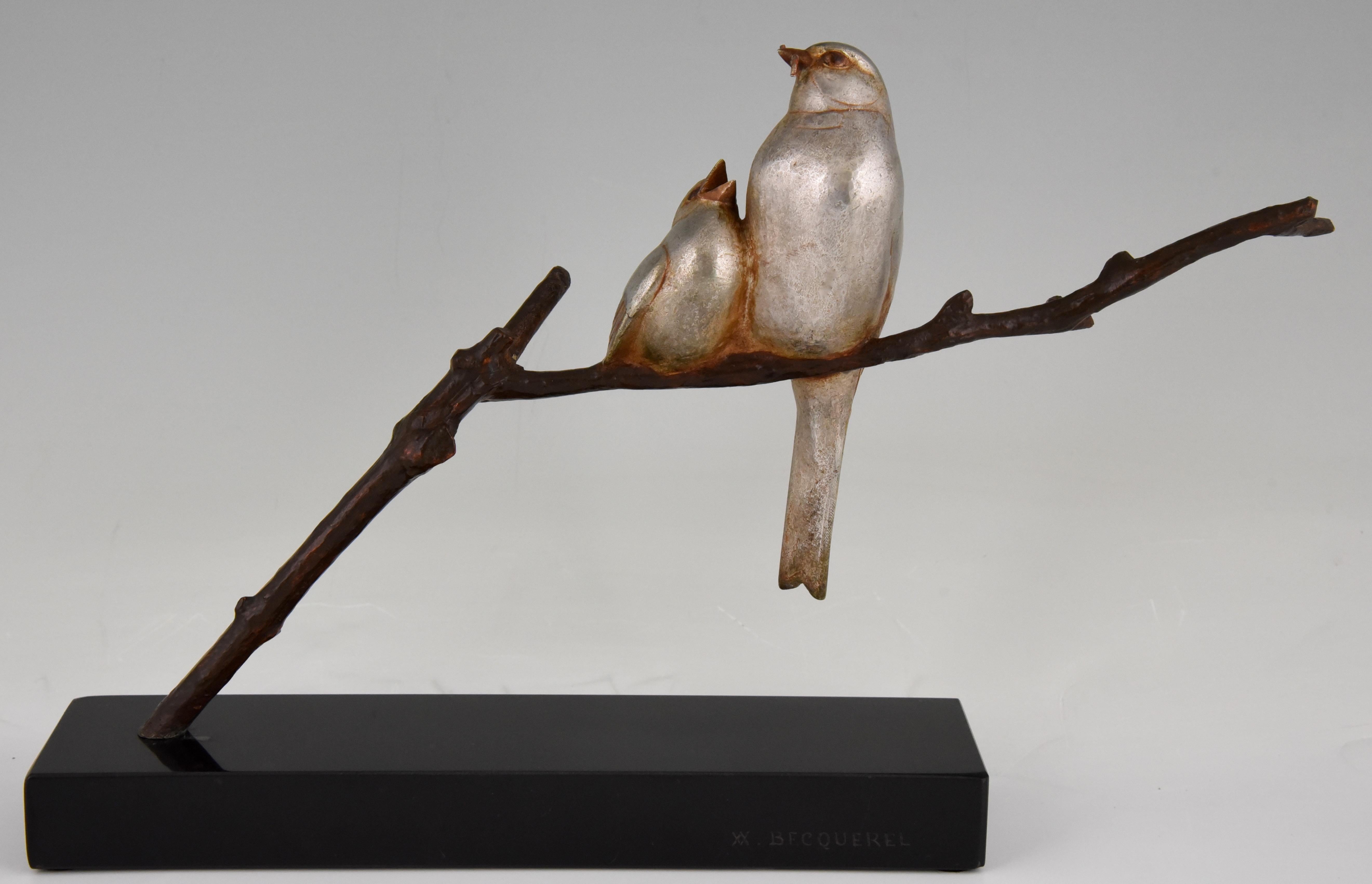 Cute Art Deco bronze sculpture of a mother bird feeding her young with silver and brown patina, mounted on a Belgian Black marble base. Signed by Andre Vincent Becquerel France 1930

Literature:
“Art deco and other figures” by Brian Catley,