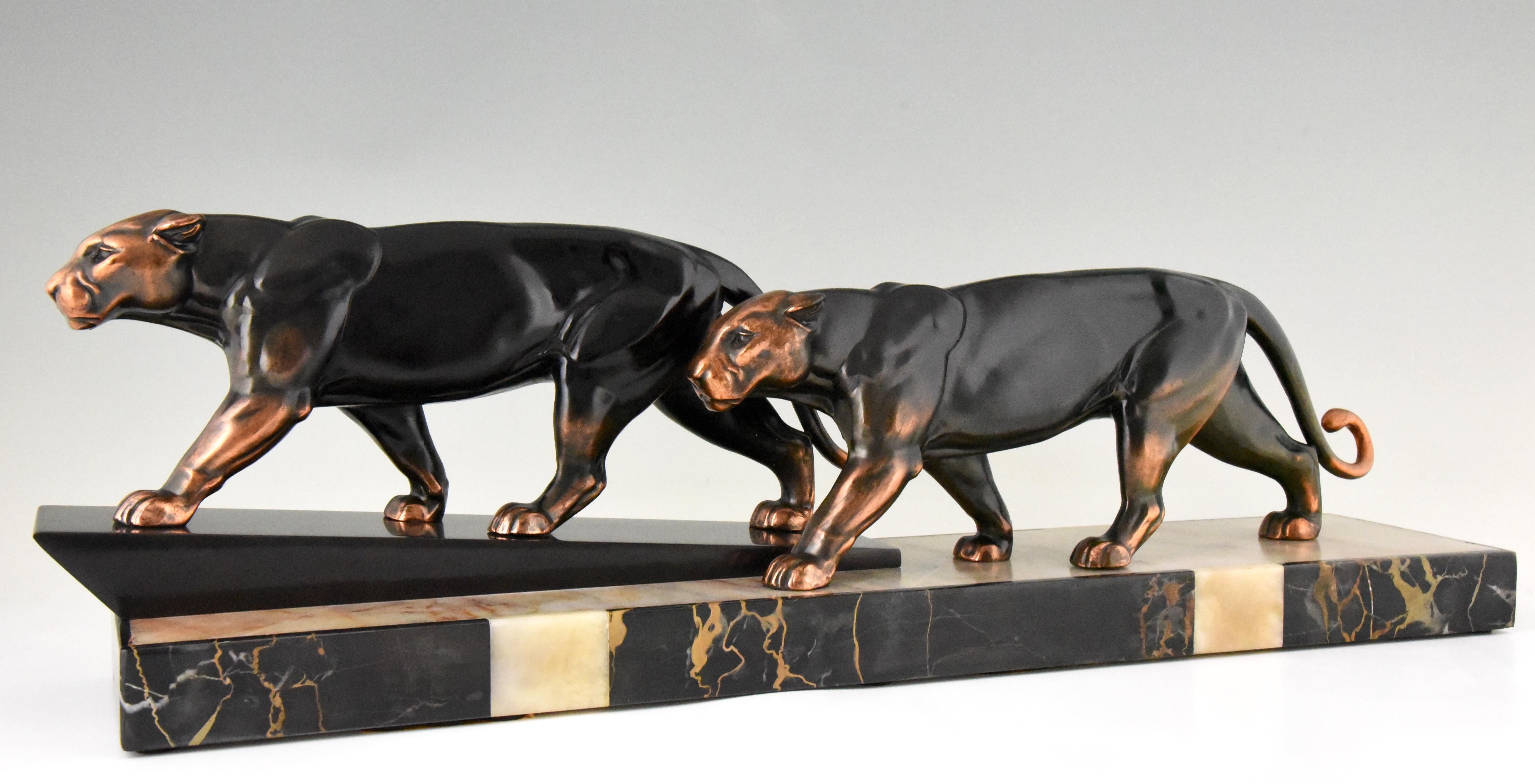 Art Deco group of two walking panthers by the French artist Alexandre Ouline in Art Metal with lovely patina on a multi-color marble base, circa 1930.
“Animals in bronze” by Christopher Payne. Antique collectors club. ?“Dictionnaire des peintres,