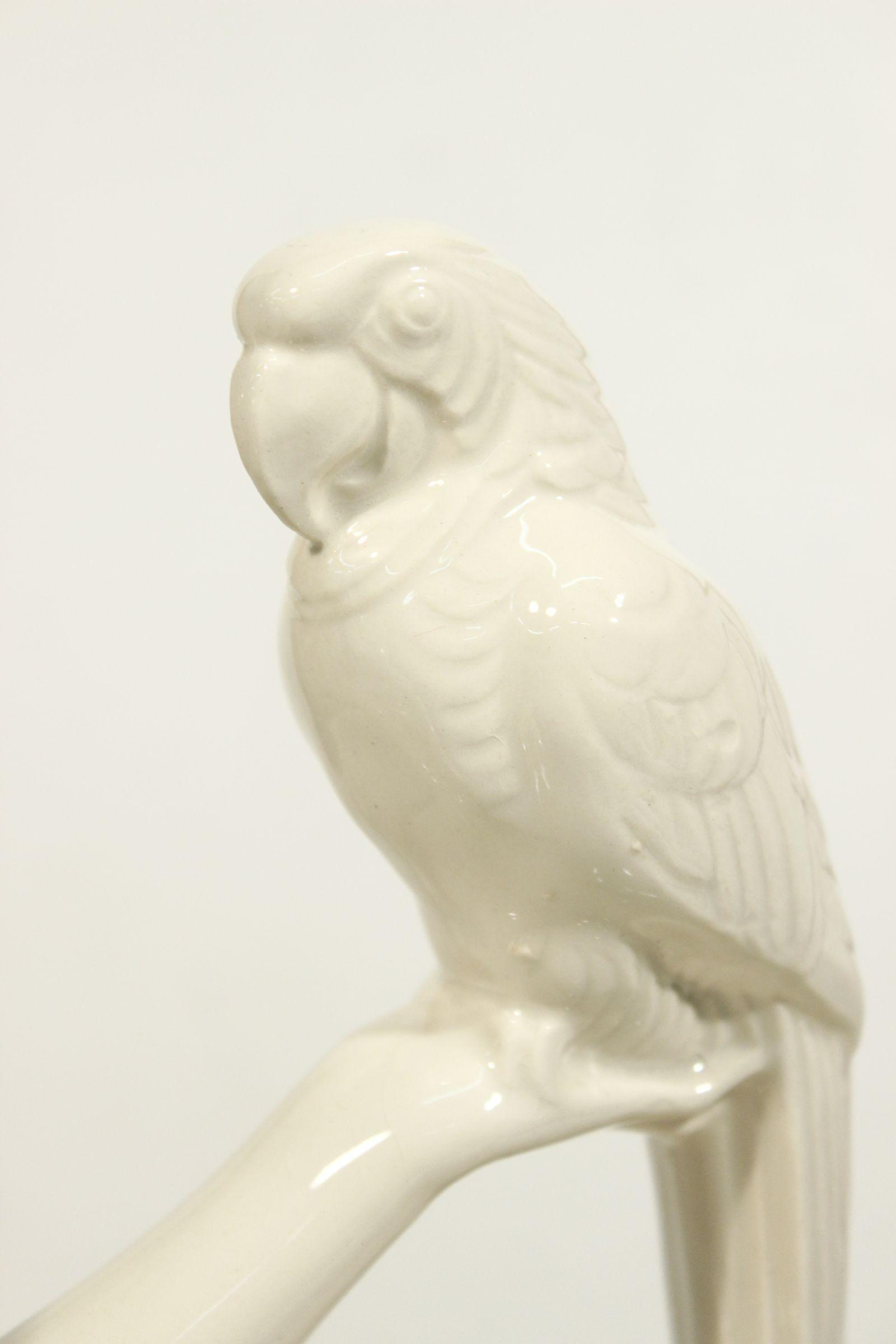 Glazed Art-déco sculpture of woman and parrot in earthenware by Sarreguemines 1930s For Sale