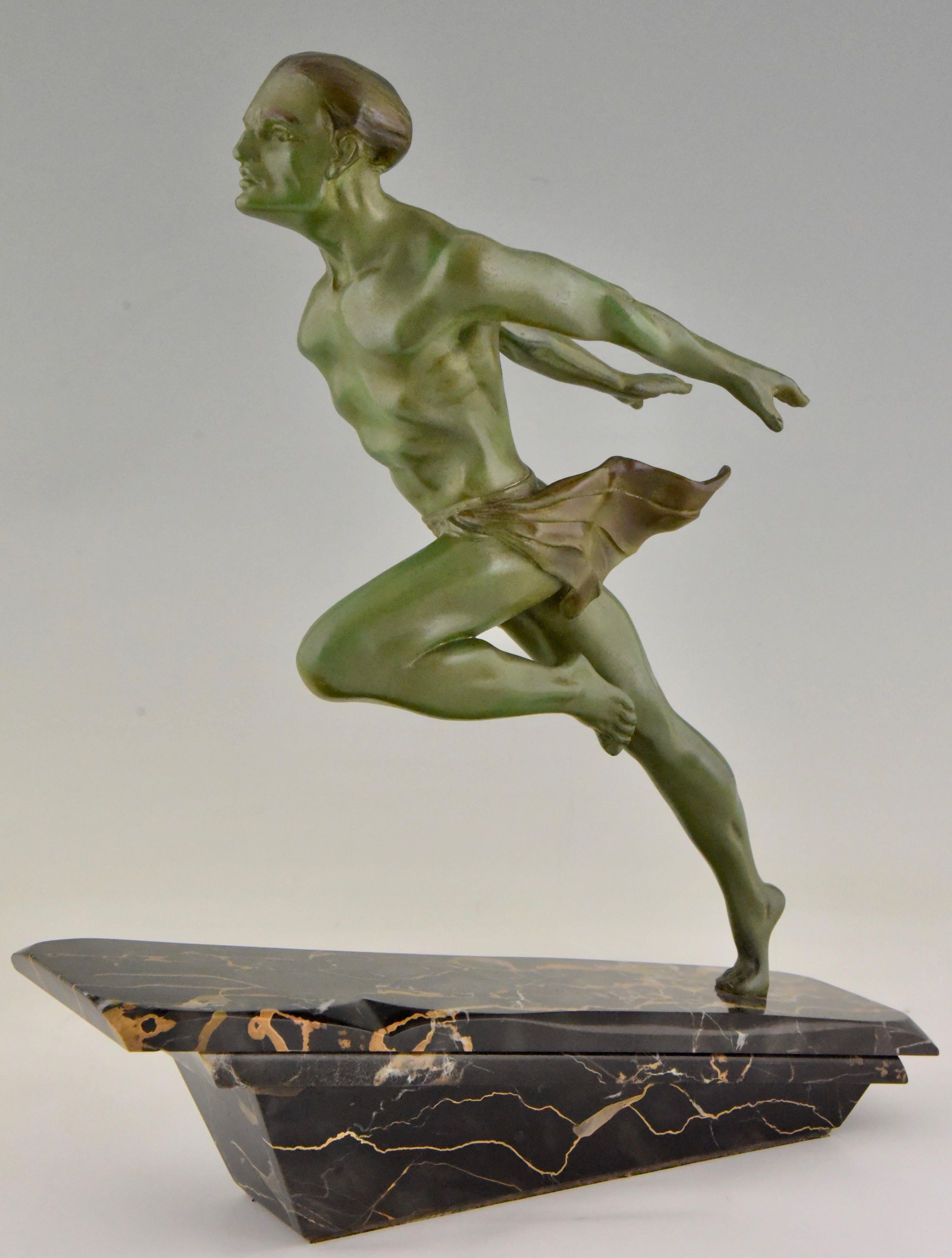 Art Deco sculpture of a running man or athlete signed by the sculptor L. Valderi, France, 1930. Patinated art metal on Portor marble base.

                         