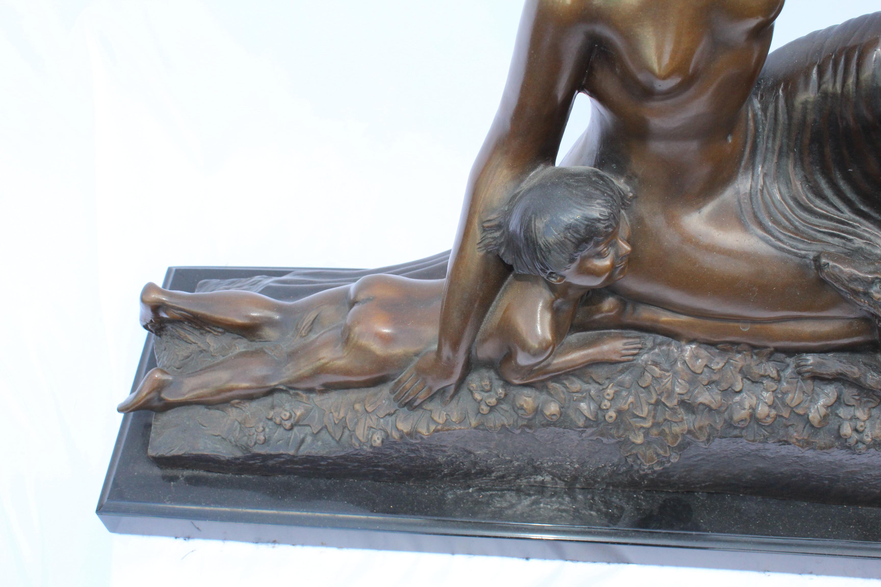 A nice size bronze casting of a Semi-nude girl seated with small child and a dog holding a bunch of Flowers. The Artist name is visible in the dress at the bottom ( Delandre). A Large size with multi-patinas with great details. Mounted on a large