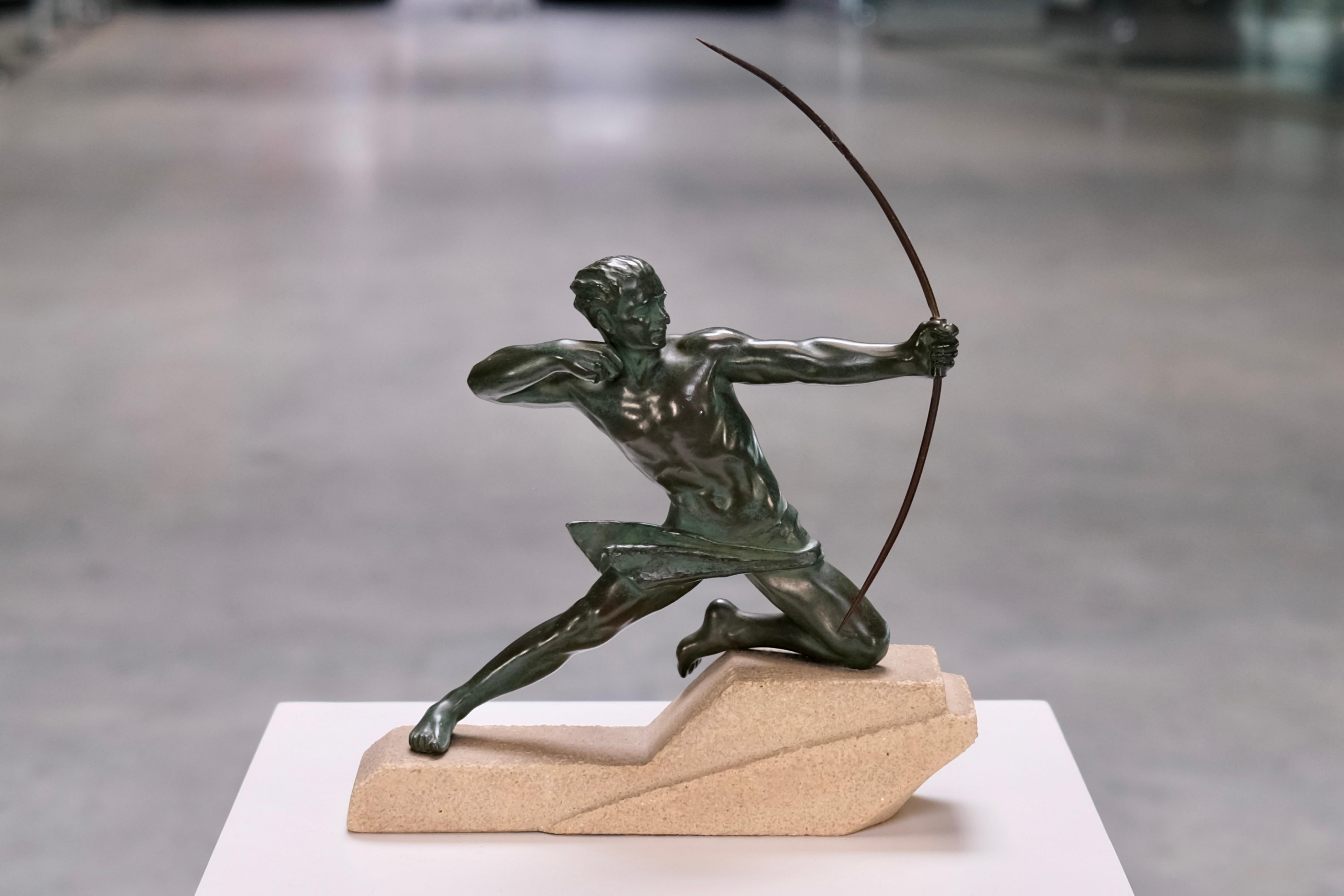 Art Deco sculpture, French figurative sculpture, 1920s decorative art – this original piece by Max Le Verrier captures the masculine ideal in motion. Titled Spartiate, the dynamic archer is shown in a moment of perfect tension, just before release,