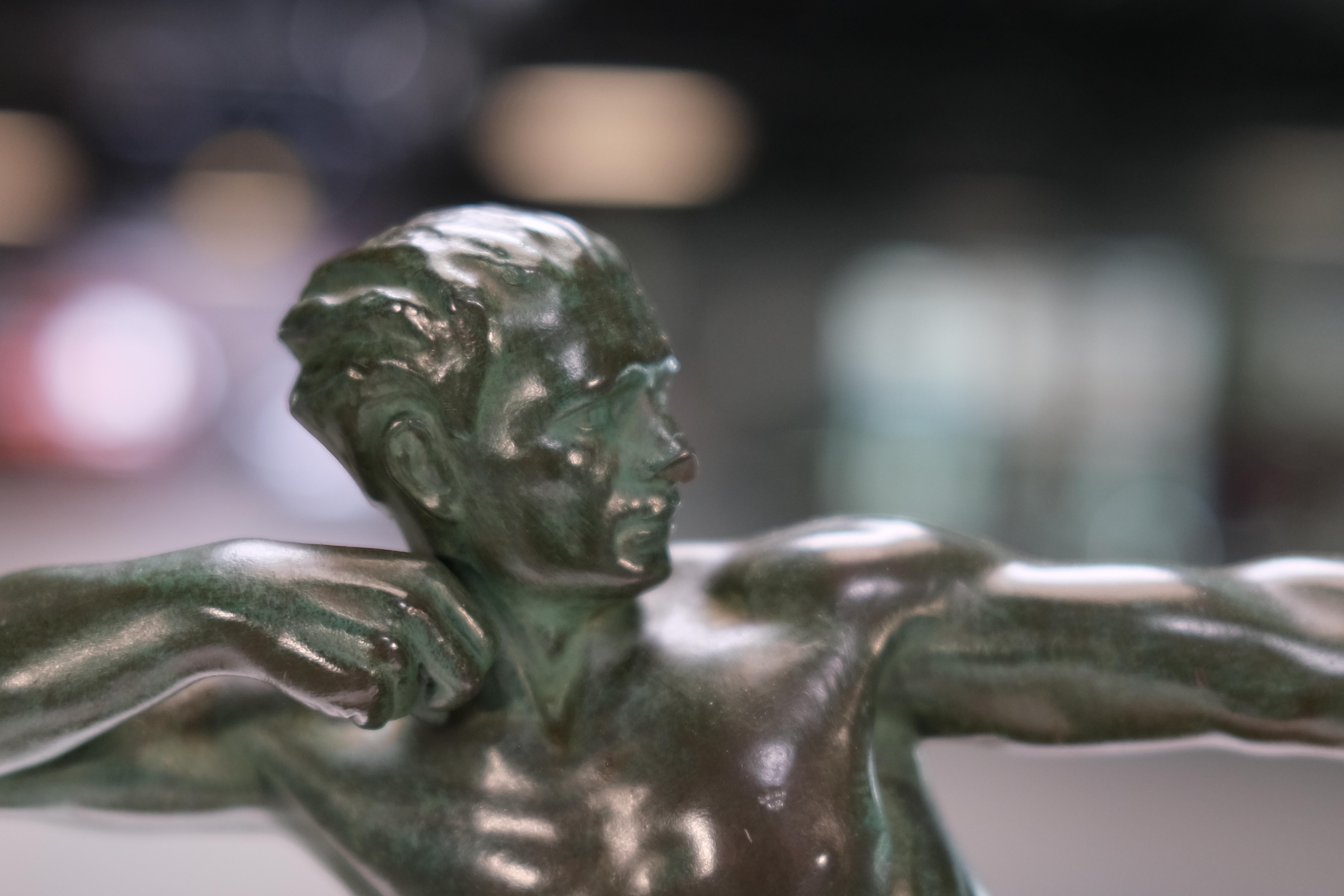 Patinated Art Deco sculpture Spartiate by Max Le Verrier, Spelter and Stone, France 1920s For Sale