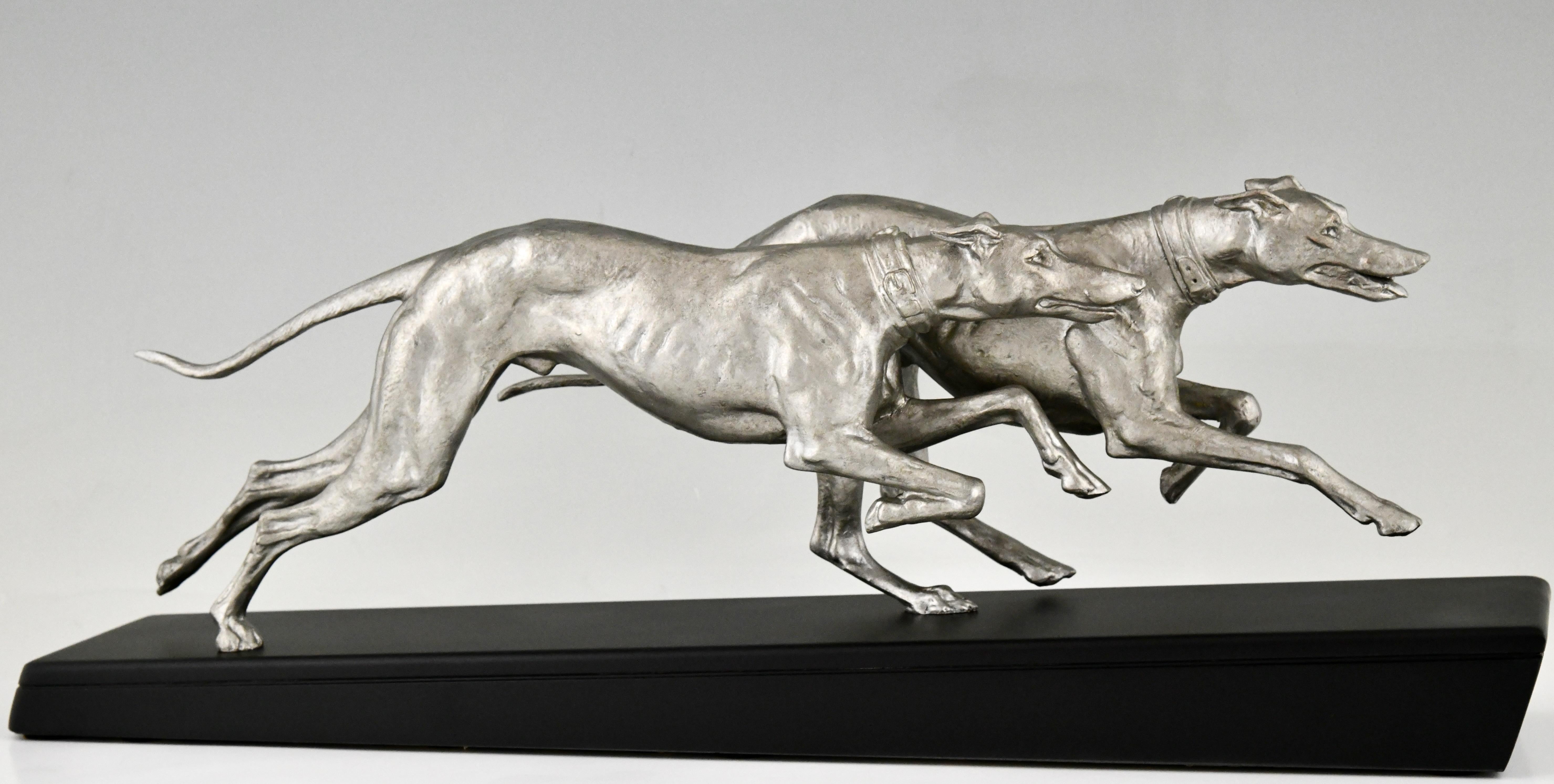 Art Deco sculpture two greyhounds signed by Plagnet. 
Art metal with silver patina on a Belgian Black marble base. 
France 1930. 