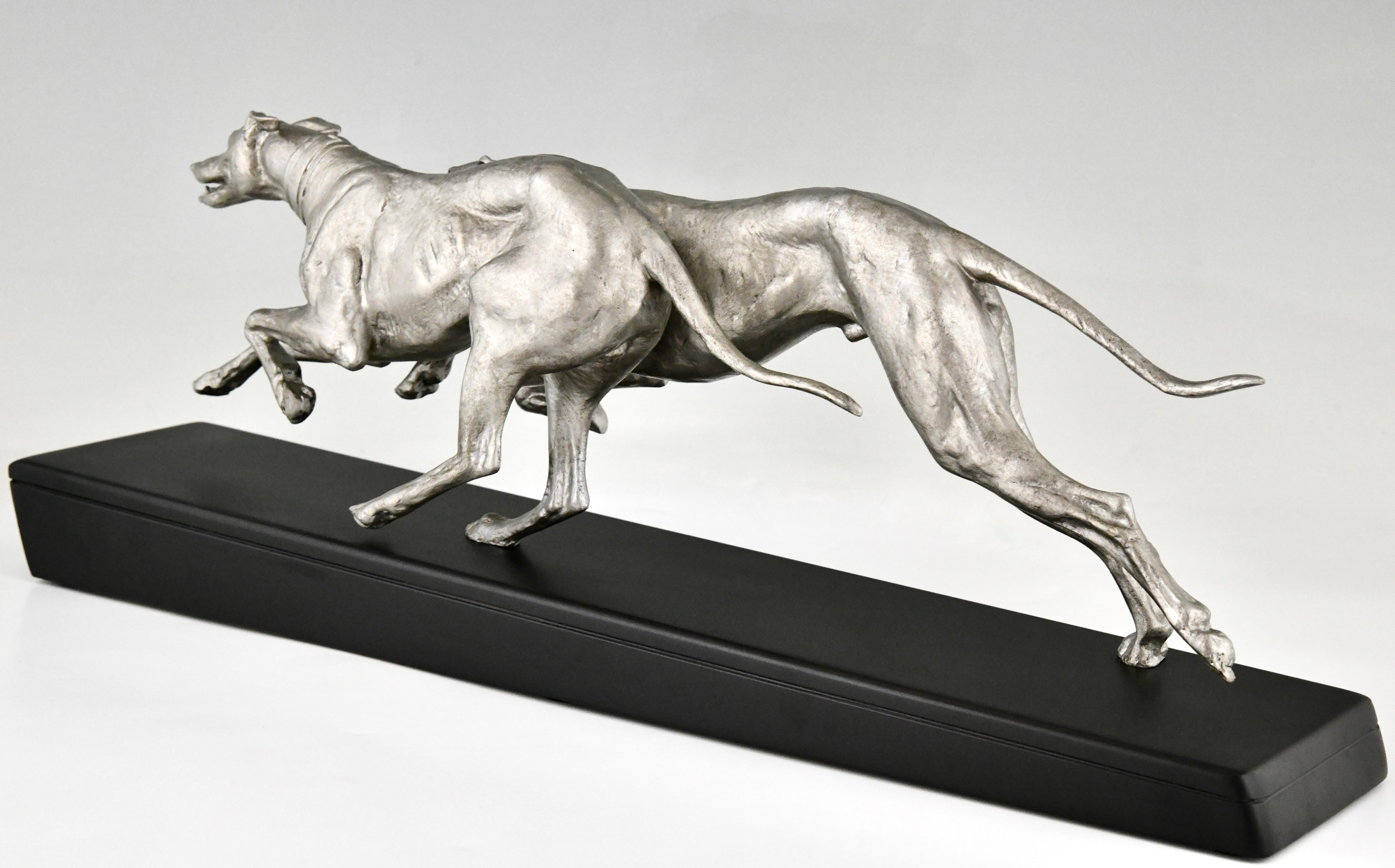 Metal Art Deco sculpture two greyhounds signed by Plagnet France 1930.  For Sale