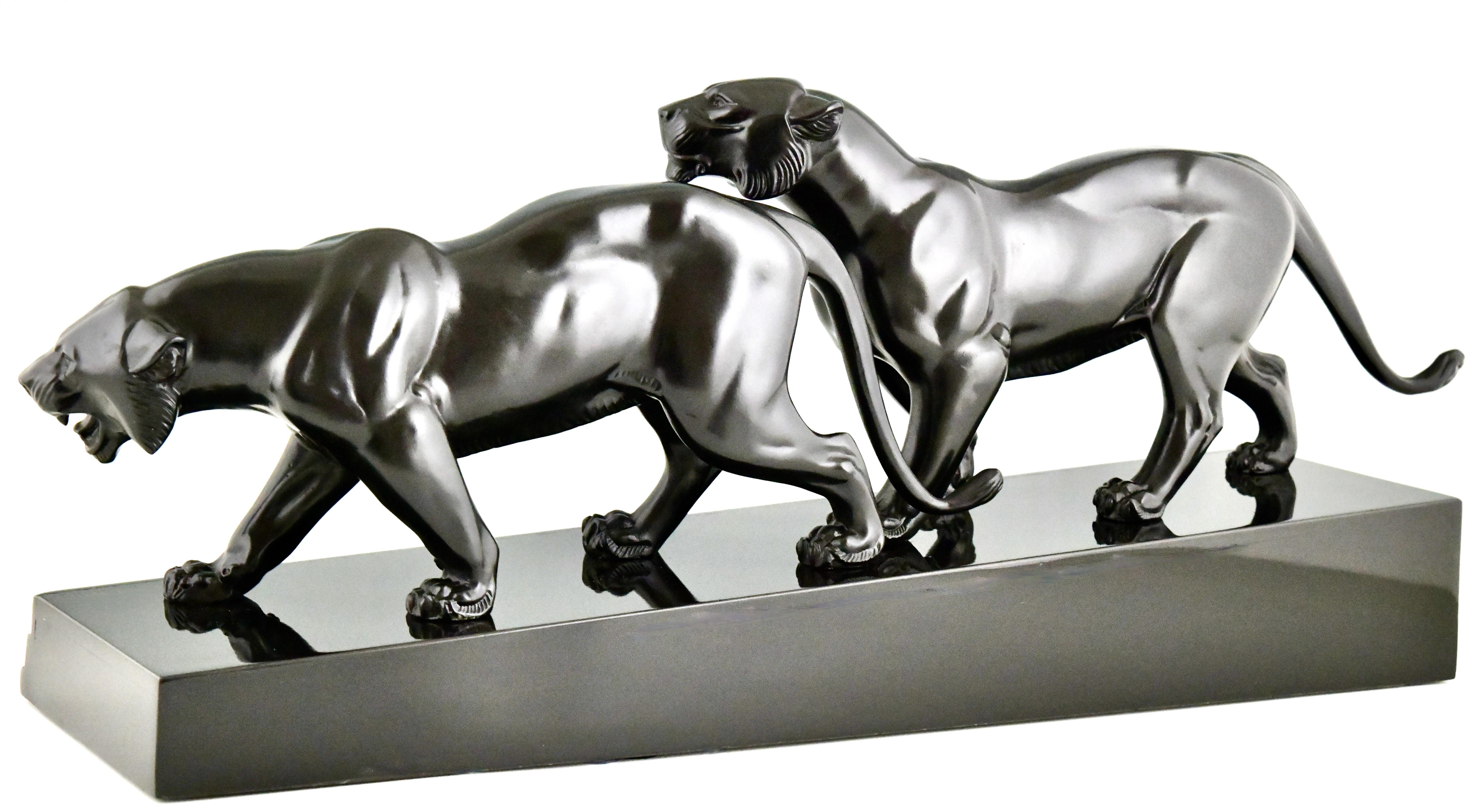 Patinated Art Deco sculpture two panthers signed by Irene Rochard.  For Sale