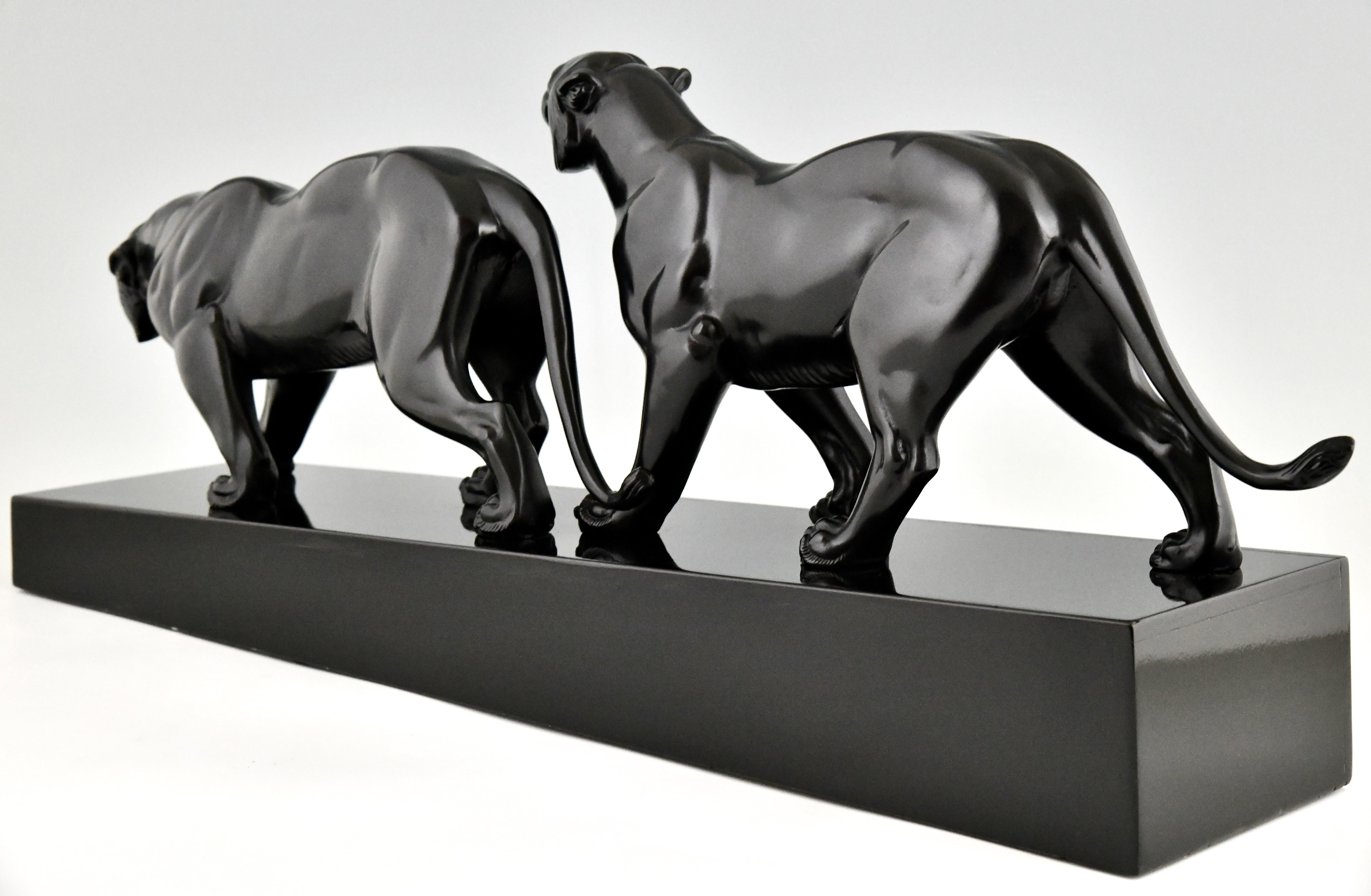 Mid-20th Century Art Deco sculpture two panthers signed by Irene Rochard.  For Sale