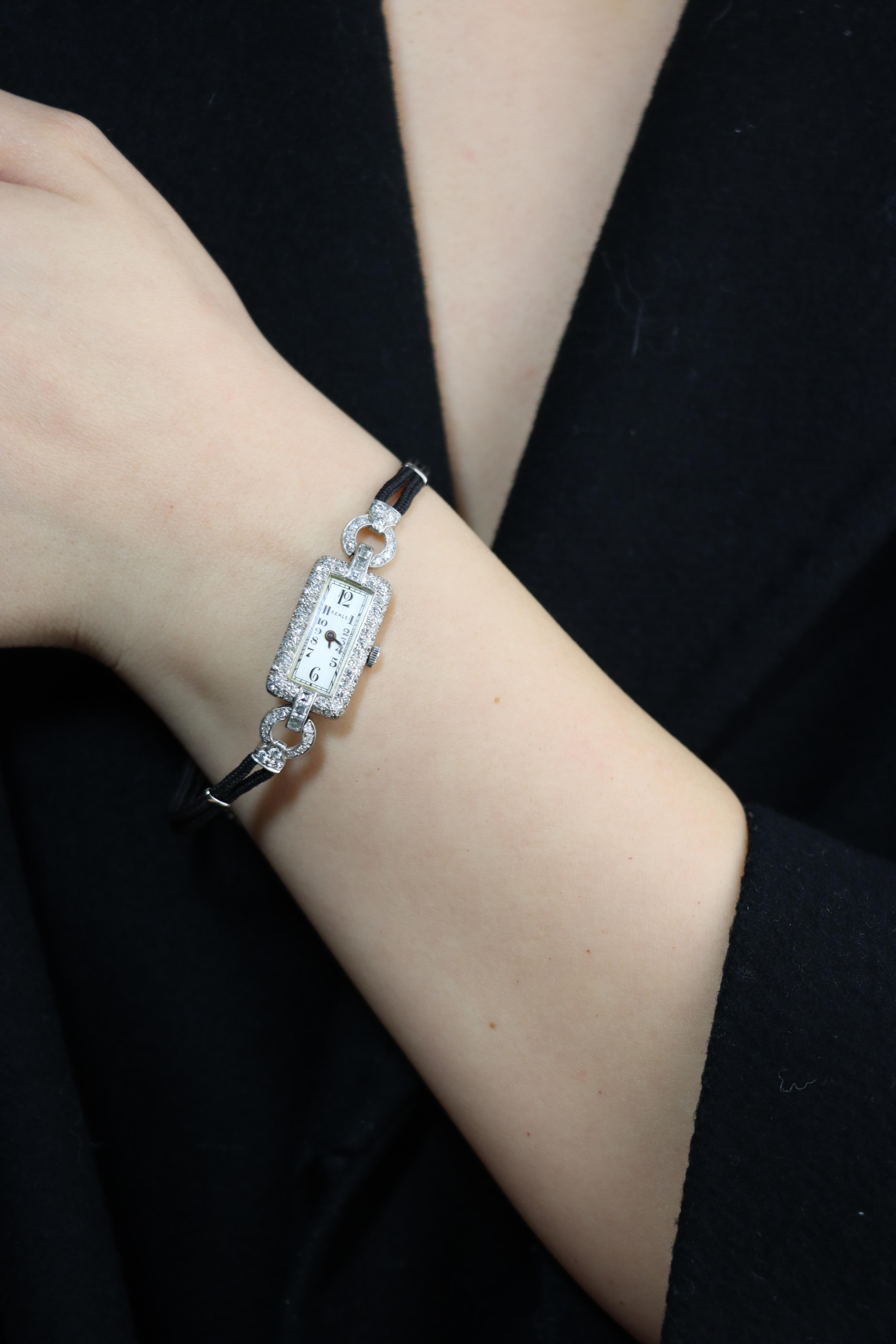 Art Deco Seale Platinum Diamond Watch Bracelet

Buckle —— Stainless Steel

Approximate Dimensions:
18.5 cm (Bracelet Length)
2.2 cm (Length)
1.2 m (Width)
 13.9 grams in weight.
