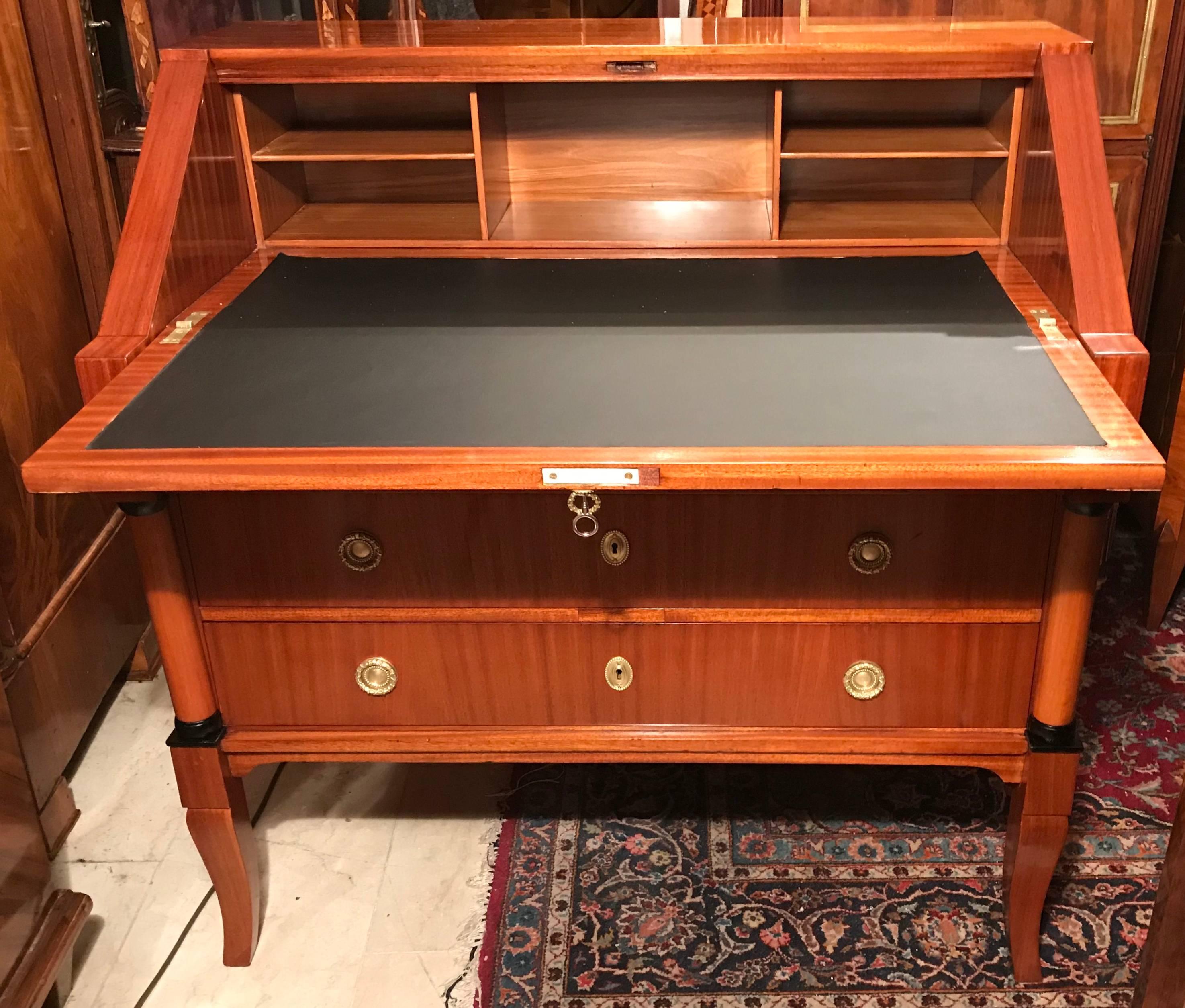 Art Deco secretaire, Germany, circa 1920, mahogany veneer, with elmwood marquetry and ebonized accents. The desk top covered with leather (replaced). The secretaire is in excellent condition, professionally restored. It will be directly shipped from