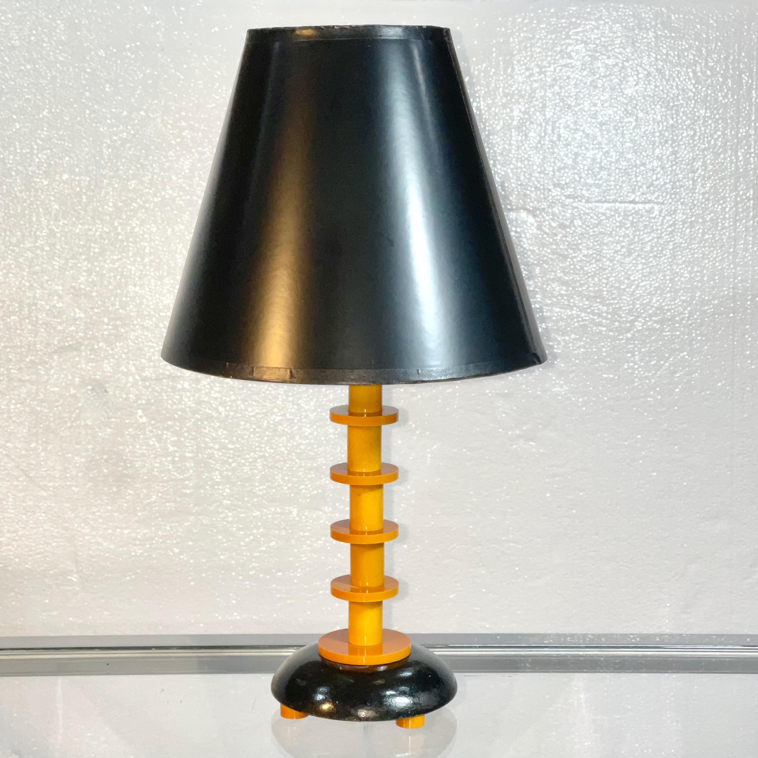 American art deco petite table lamp made of segmented butterscotch bakelite. Includes lampshade as shown.