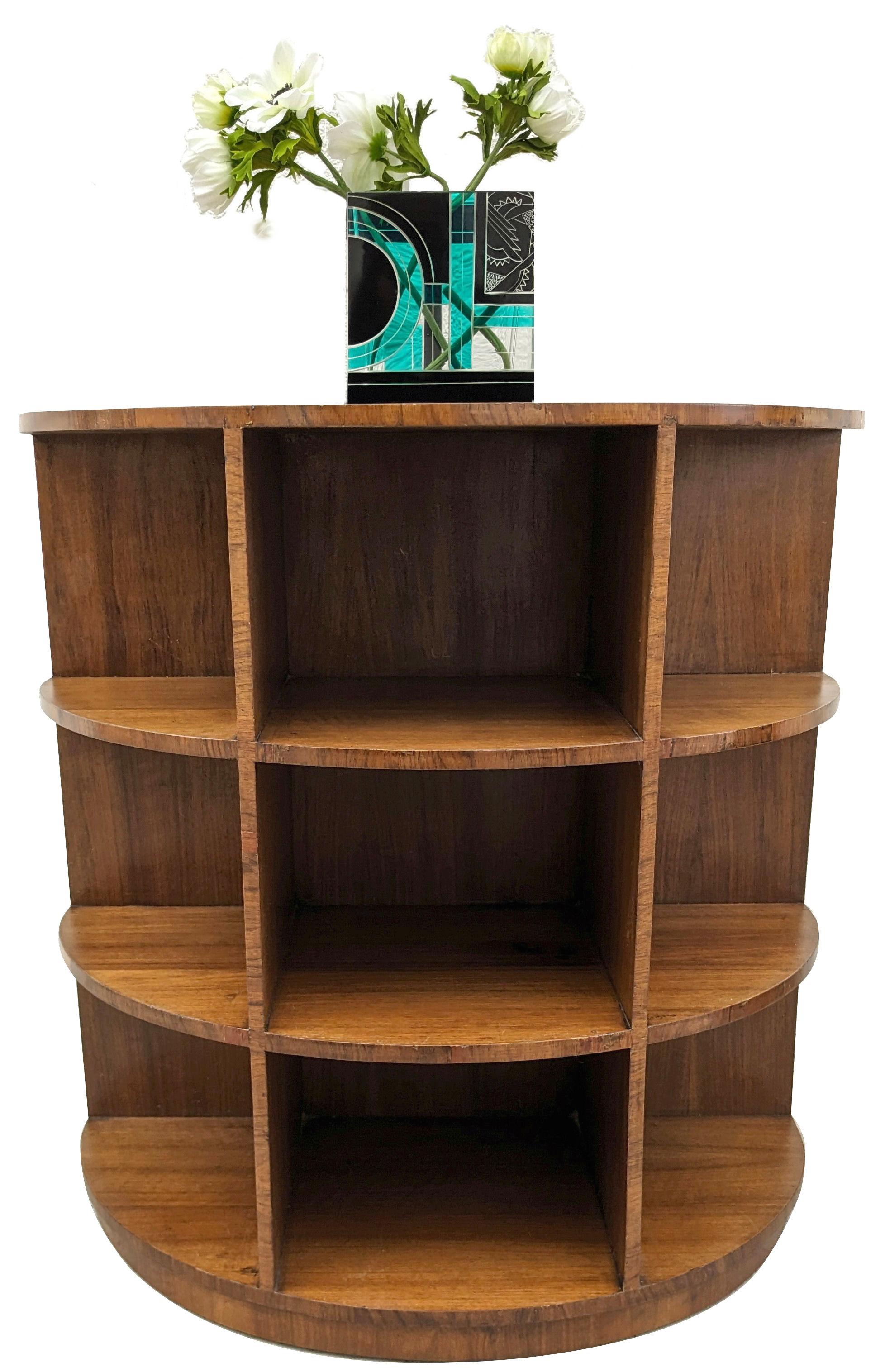 For your consideration is this very attractive Art Deco half circle walnut bookcase. Dating to the 1930's and English in origin this fabulous piece could either work as intended for books or would also be great for displaying collections. Features