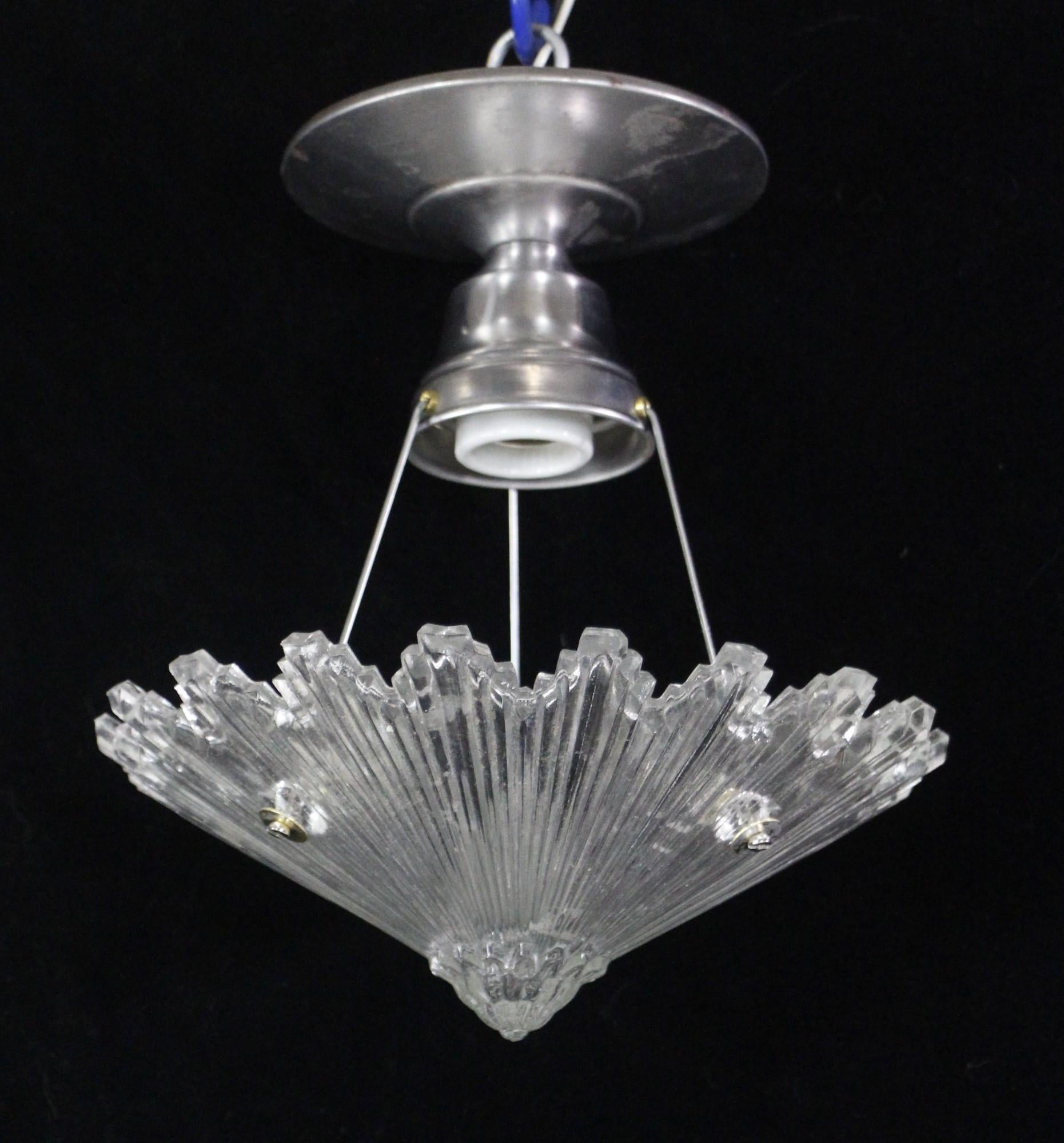 Early 20th century Art Deco style semi flush mount pendant light with a nickel plated steel fitter. Clear starburst design shade. Takes one E26 light bulb. 