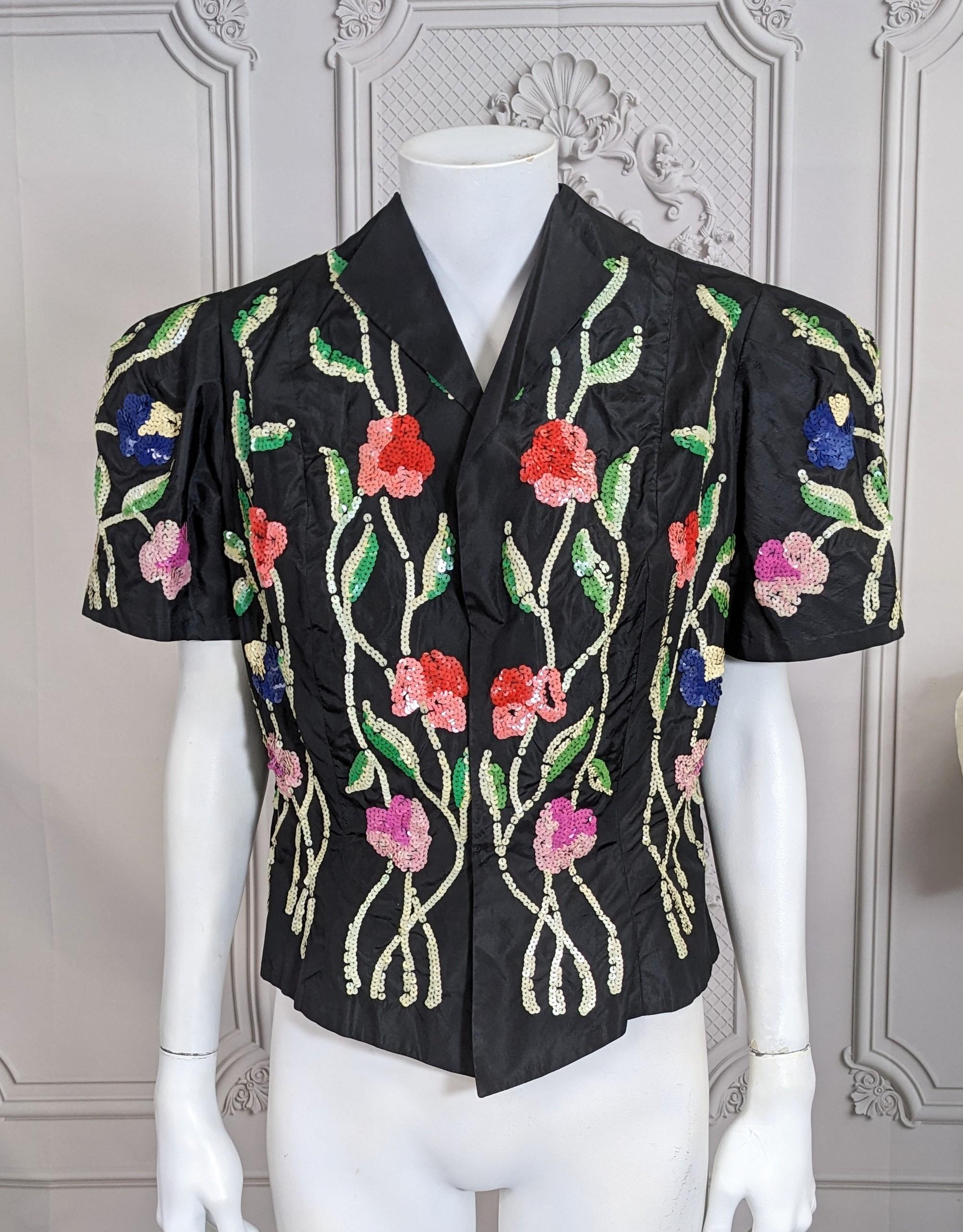 Charming Art Deco Sequin Evening Jacket on black silk taffeta base. Vibrant sequined florals grow up the fitted body with exaggerated puff sleeves. 1930's USA. Small size. 
