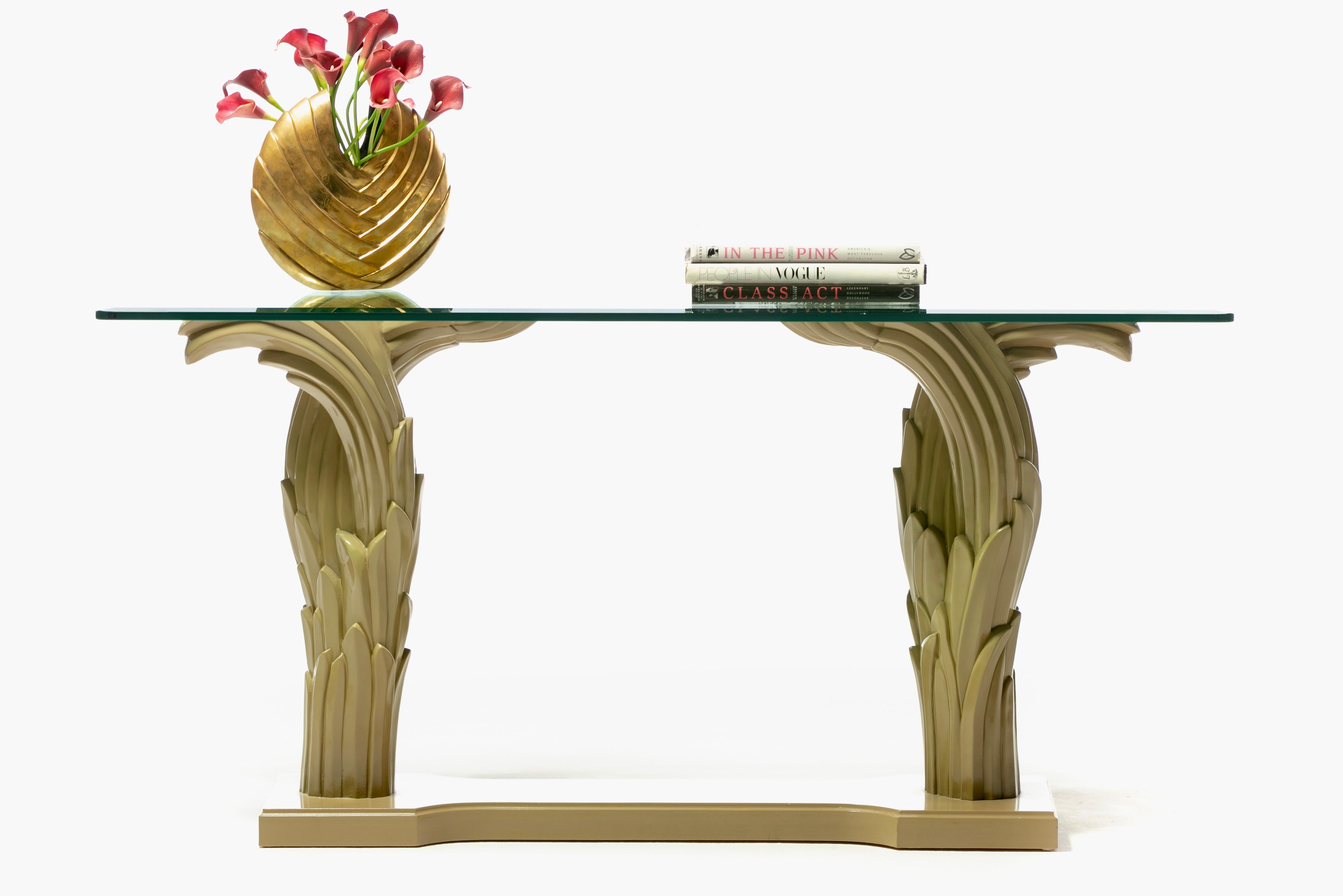 Dramatic Art Deco Style Palm Leaf console lacquered in eye catching almond latte lacquer with a beveled edge tempered glass top. French Riviera inspired elegance. Glamorous. Gregarious. Palm leaf forms reminisce of pieces by celebrated French