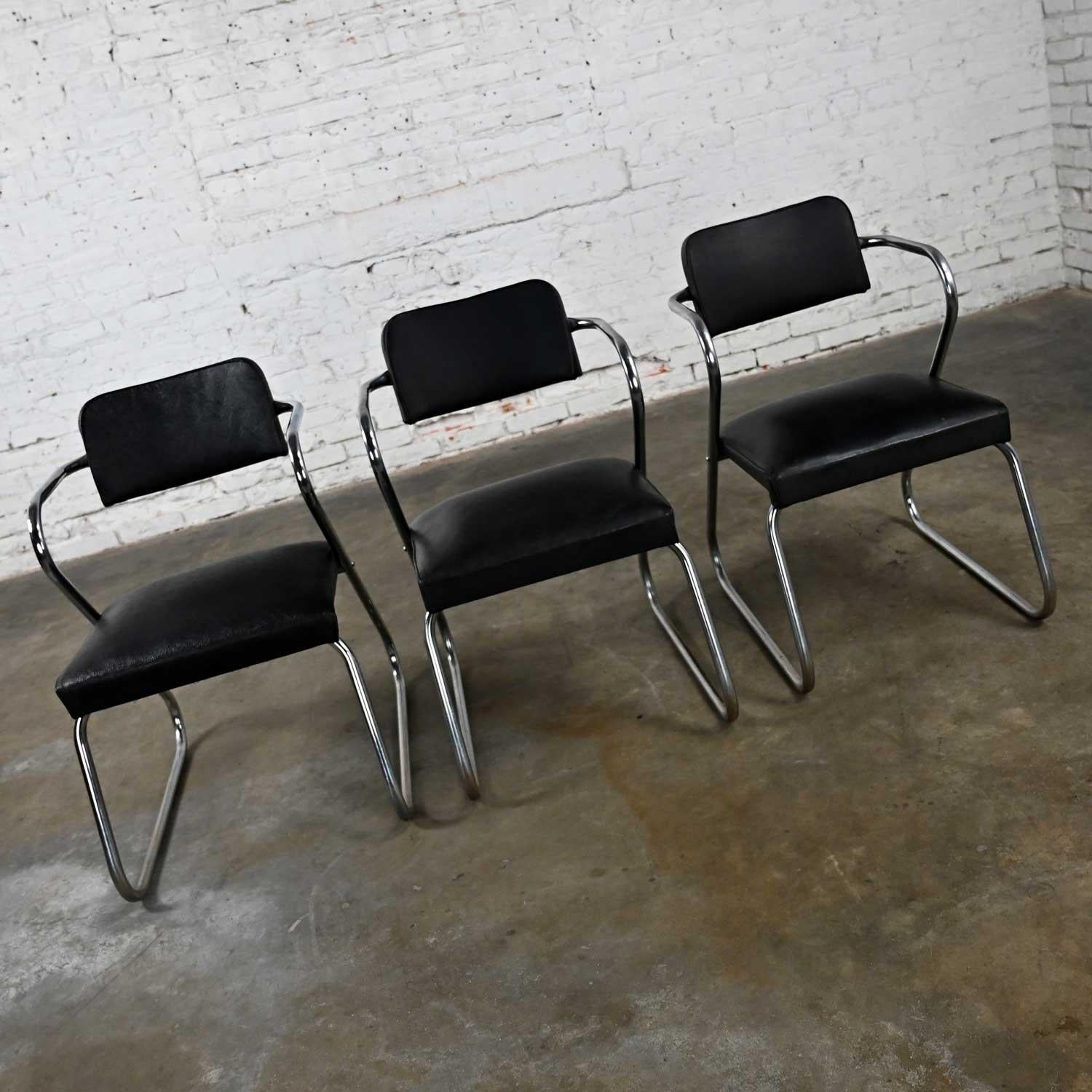 Fantastic vintage Art Deco set of 3 chrome tube and original black vinyl or faux leather chairs attributed to Kem Weber Z Chair. Beautiful condition, keeping in mind that these are vintage and not new so will have signs of use and wear. The frames