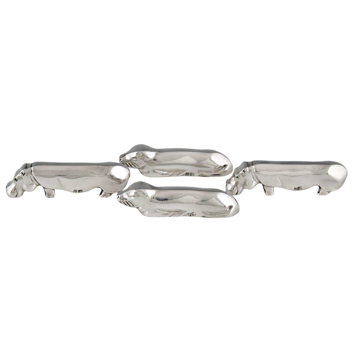 Art Deco set of 12 animal knife-rests by Ercuis, France 1930. 
Silver plated metal. Stamped with Ercuis centaur mark. Stamped number. 
Animals: 2 x hippo, duck, cat, bird, seal & rabbit.

Literature:	
Silver 1880-1940, Art Nouveau & Art Deco,