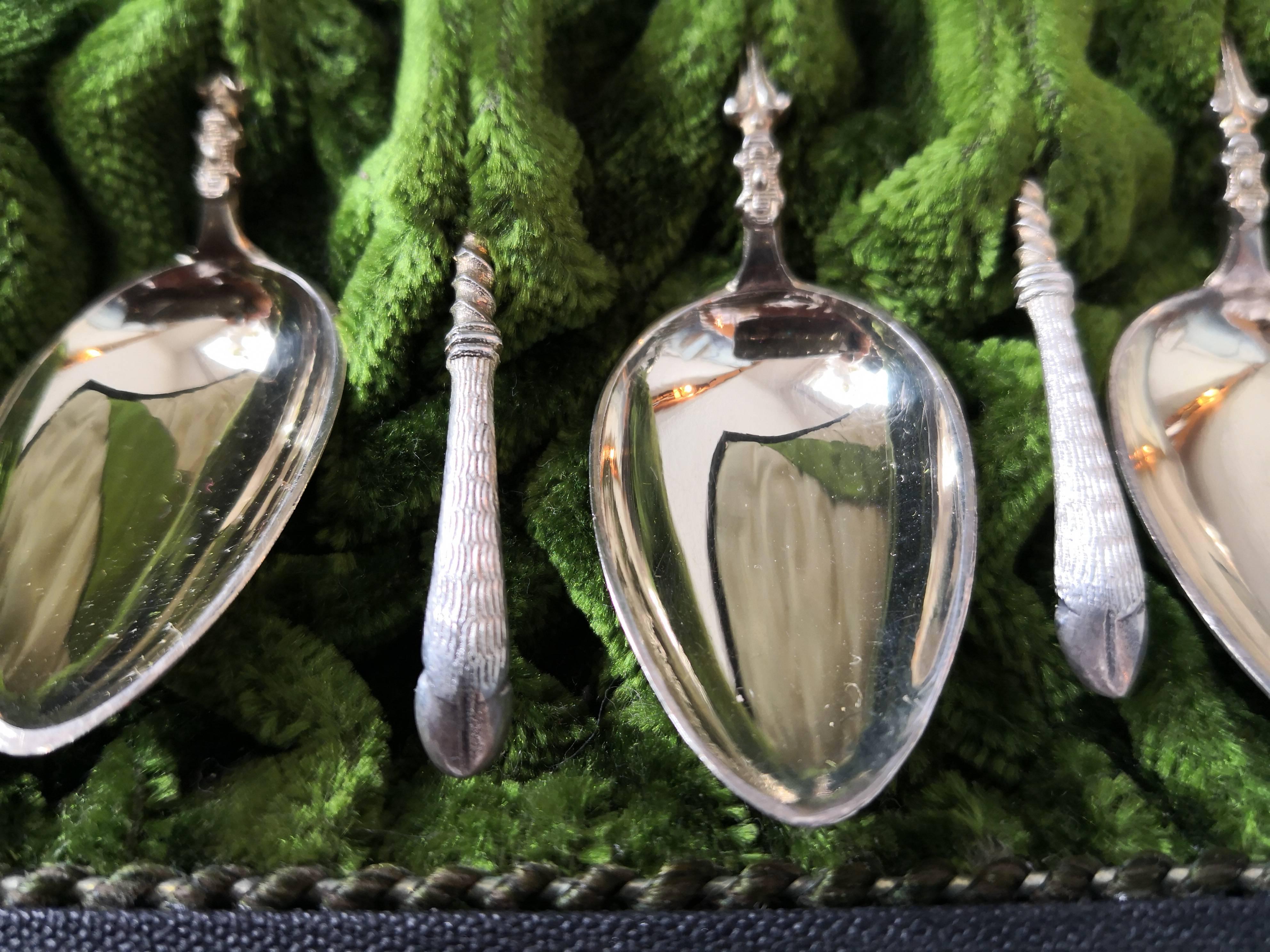 Set of 12 mocha spoons in silver with extraordinary sculptural deer hoofs at the end of the spoon. Stamped 800 silver and German hallmark crown and half moon. The set comes in original box with green velvet inside. The box is in perfect condition.