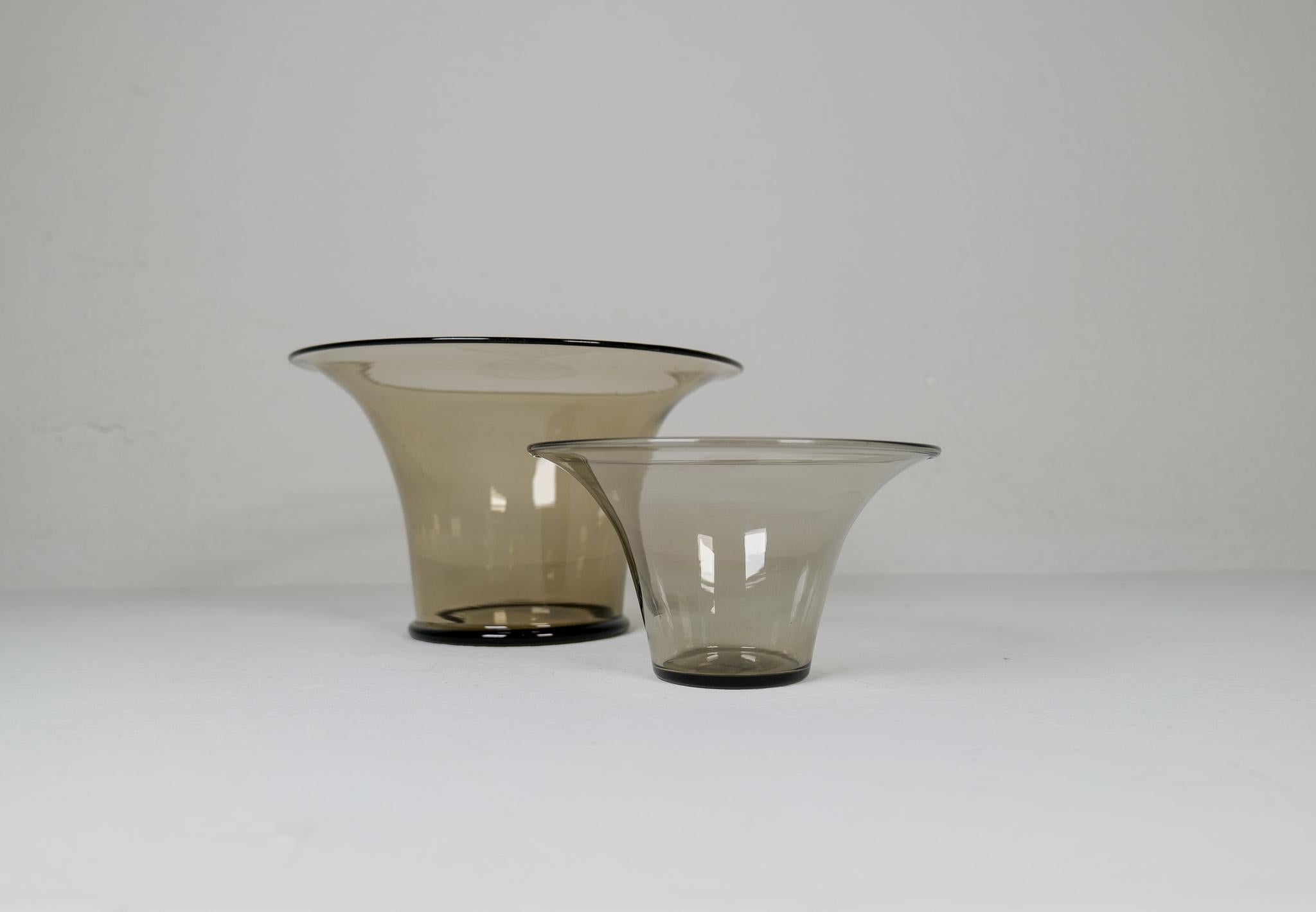 This pieces where made at Orrefors Sandvik and designed by Simon Gate in the 1920s-1930s Sweden.
The have light brown tone in the glass. Wonderful shapes and lines. 

Good vintage condition. 

Measures:  H 20 cm, D 26 cm, H 13 cm, D 18cm
 