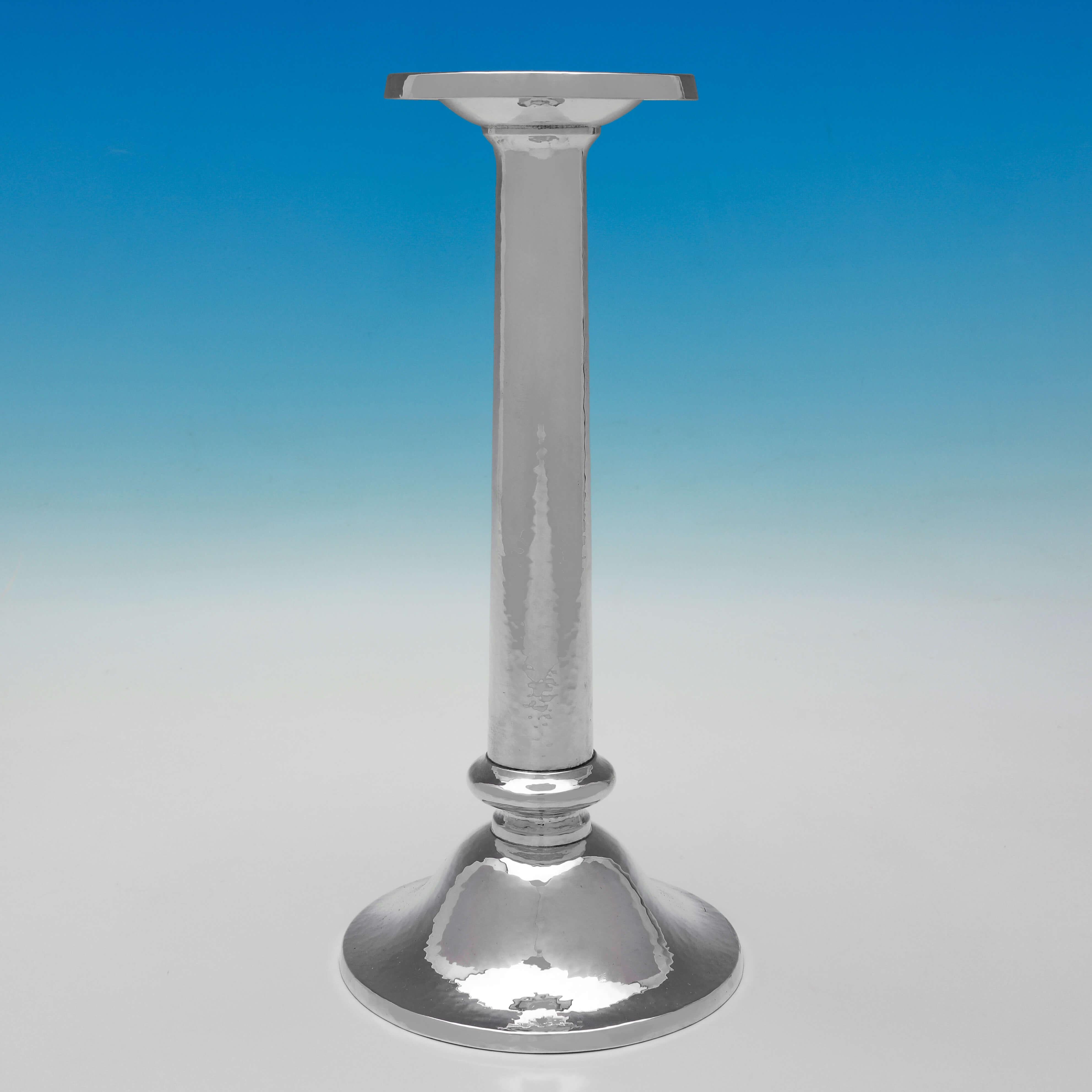 Made circa 1930 by Shreve and Co. of San Francisco, this very handsome, Art Deco Period, set of 4 Sterling Silver Candlesticks, feature a hammered finish and are incredibly stylish. 

Each candlestick measures 10