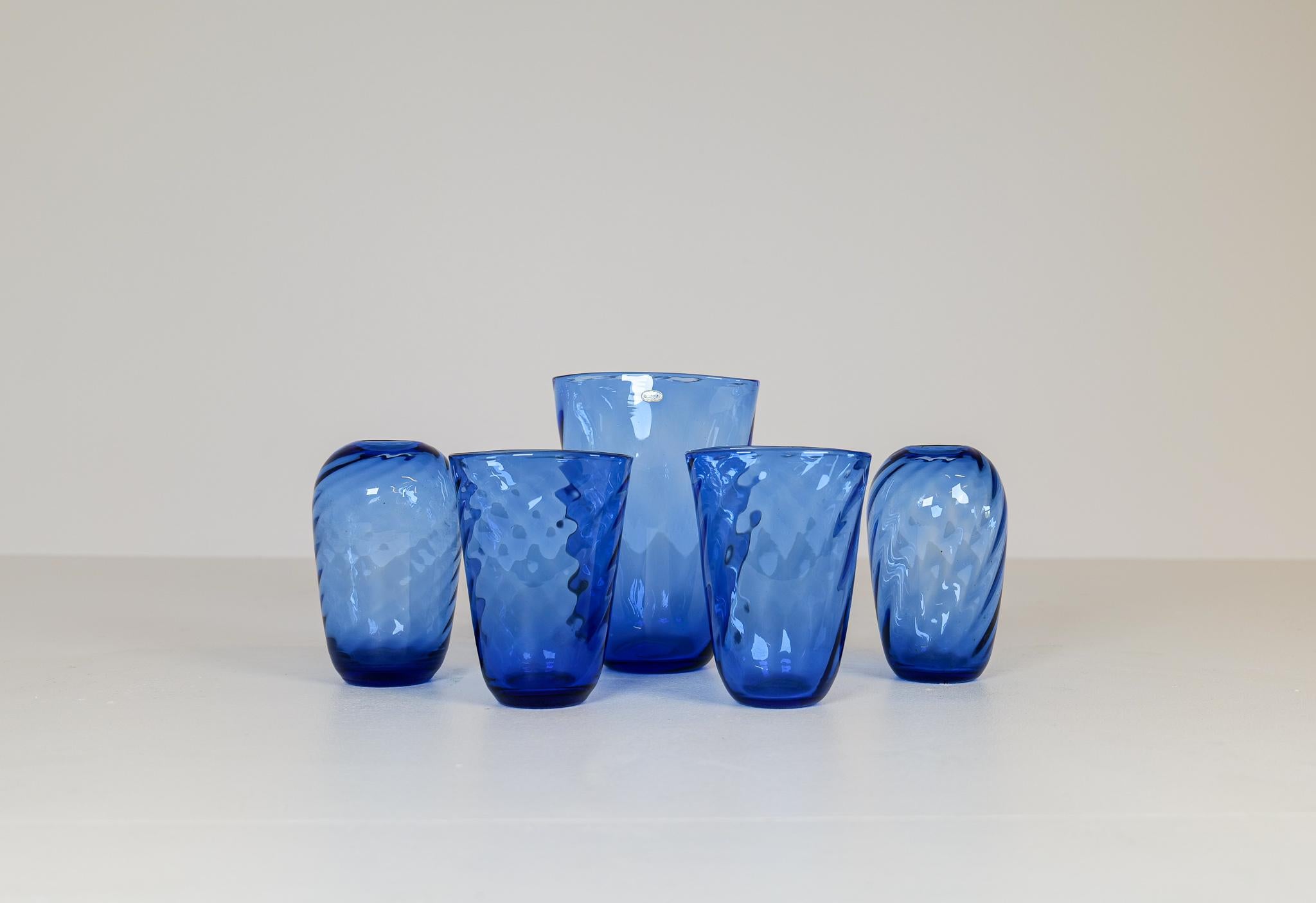 This wonderful turbine driven, blue glass vases was made in Sweden at Reijmyre. Designed by Monica Bratt. Wonderful blue color with that cool look of the glass twisting. All made by hand during the 1937-1942.

Overall good