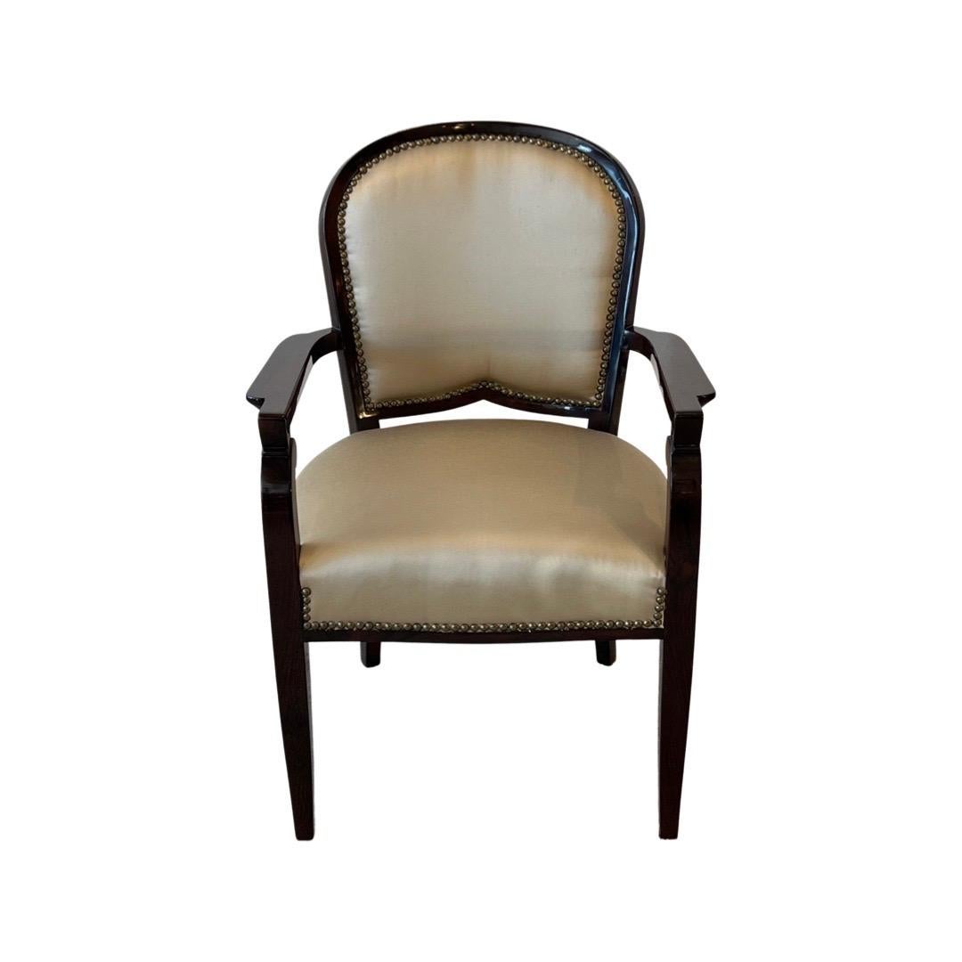 Set of 6 Art Deco dining chairs in Rosewood upholstered in Silk in a Taupe color. These chairs were designed by Jules Leleu 
Made in France.
Circa: 1930.
 
