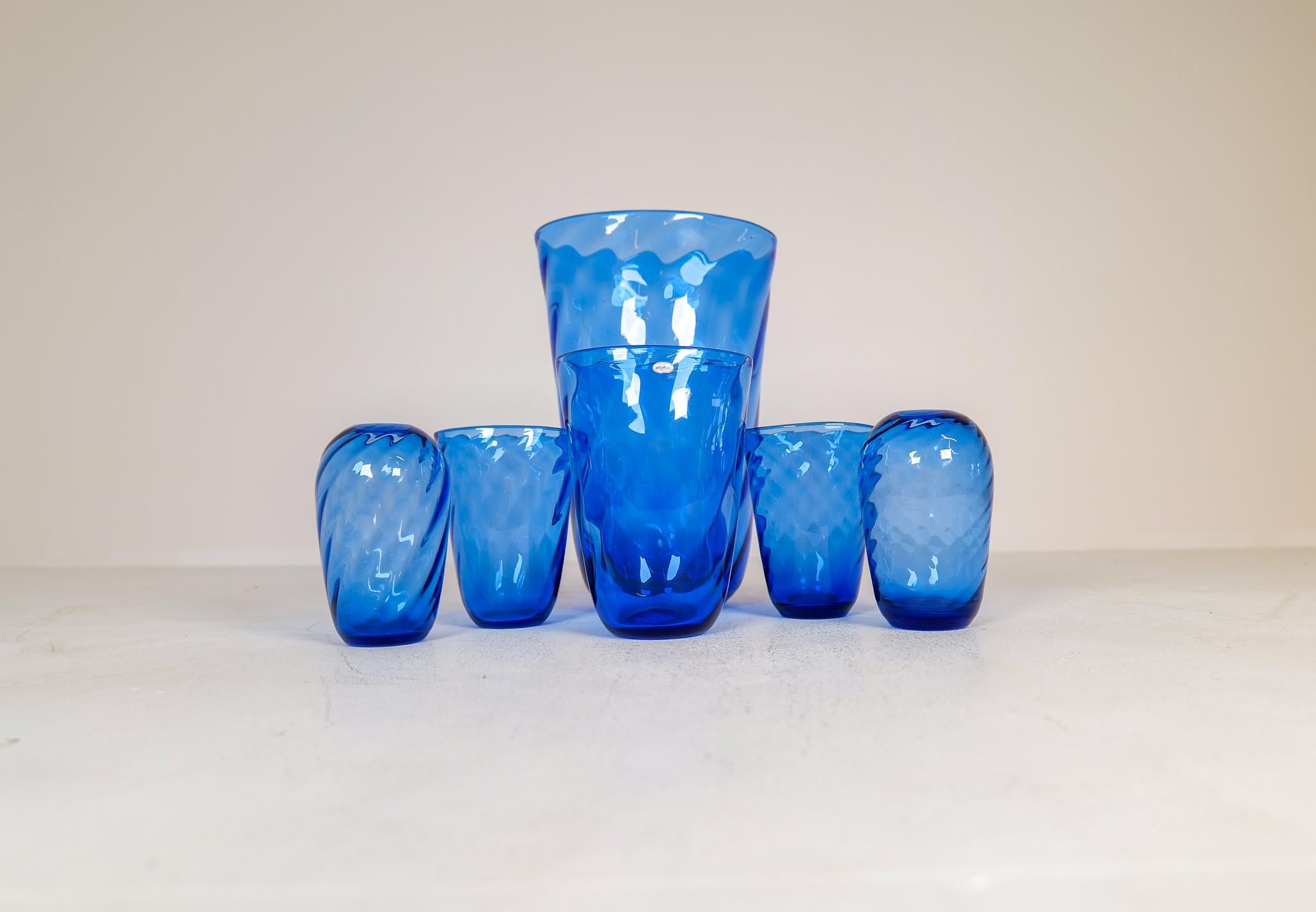 This wonderful turbine driven; blue glass vases was made in Sweden at Reijmyre. Designed by Monica Bratt. Wonderful blue color with that cool look of the glass twisting. All made by hand during the 1937-1942. Added to this collection is the very