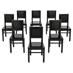 Set Art Déco di 8 sedie da pranzo in laccato nero lucido con sedute borchiate