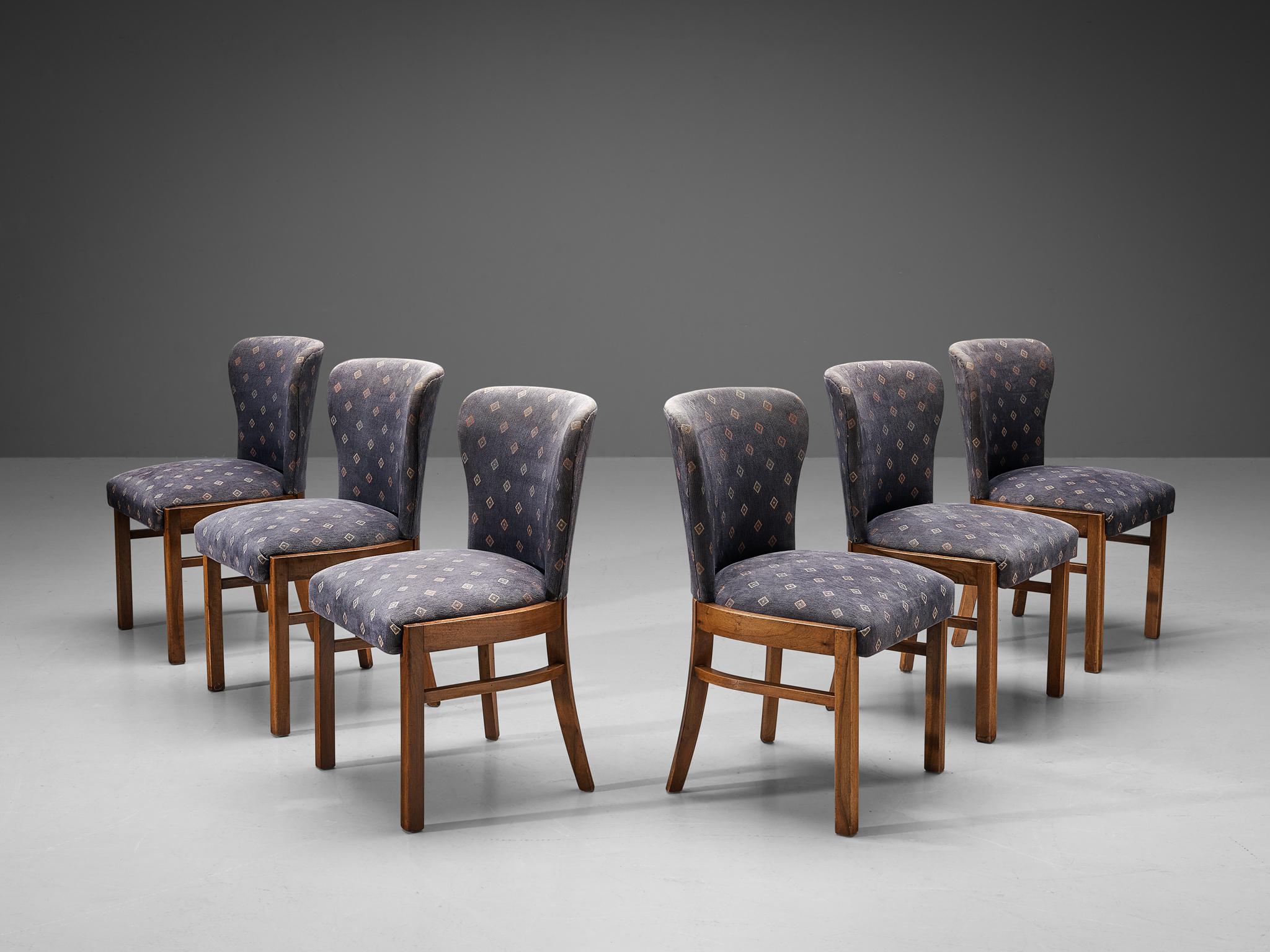 Set of six dining chairs, walnut, fabric, Europe, 1940s.

The unique lines and curves of the design are striking and the tapered wooden legs complement its shape beautifully. Highly comfortable and qualitative dining chairs. The fabric has a grey