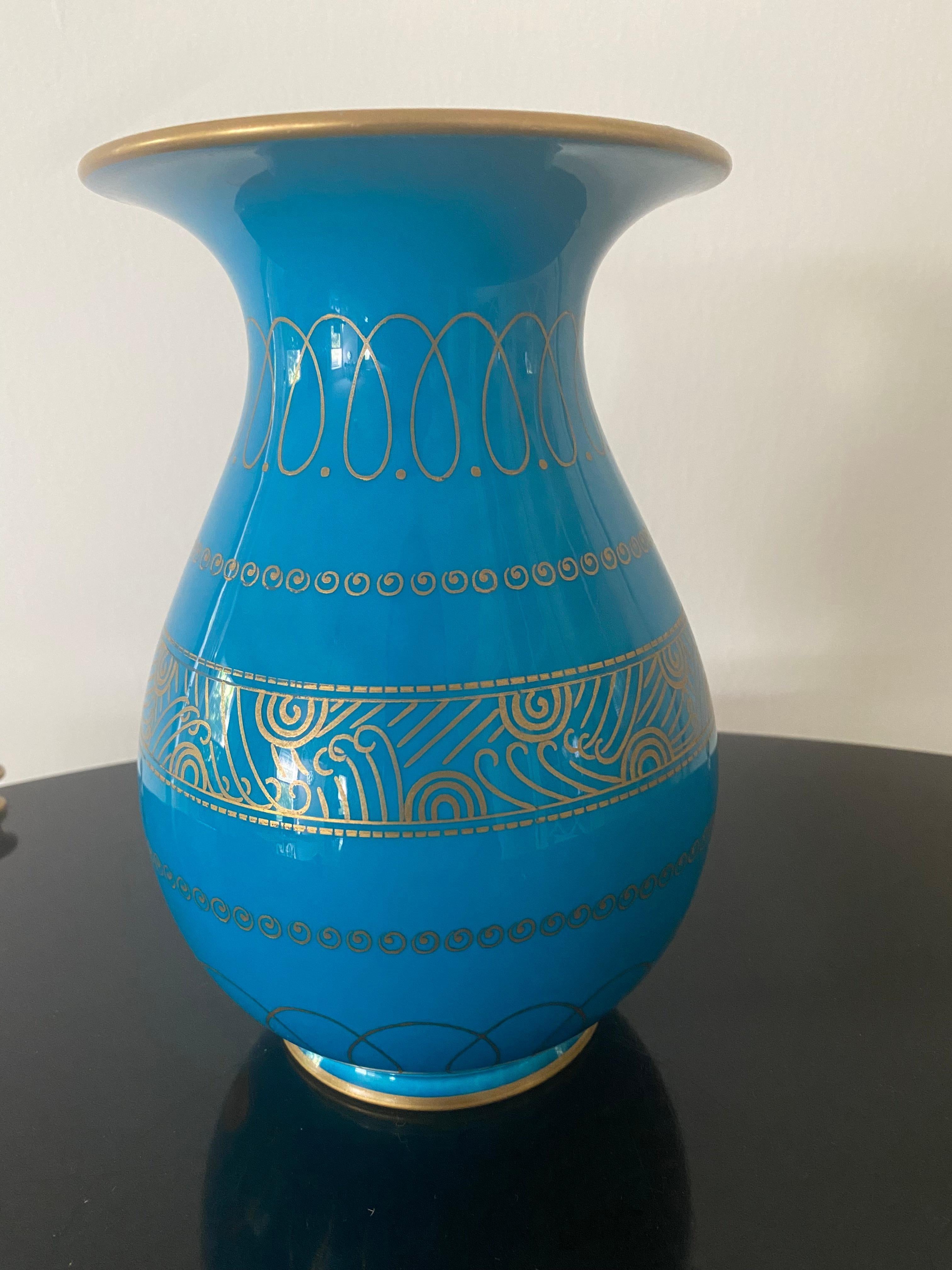 Fantastic Art Deco vase in gilt decor over rich turquoise ground.
Form designed by Emile Decoeur (1876-1953)
Decoration possibly designed by Suzanne Lalique-Haviland or Emile-Jacques Ruhlmann.

Remnant of exhibition label (50) and department store