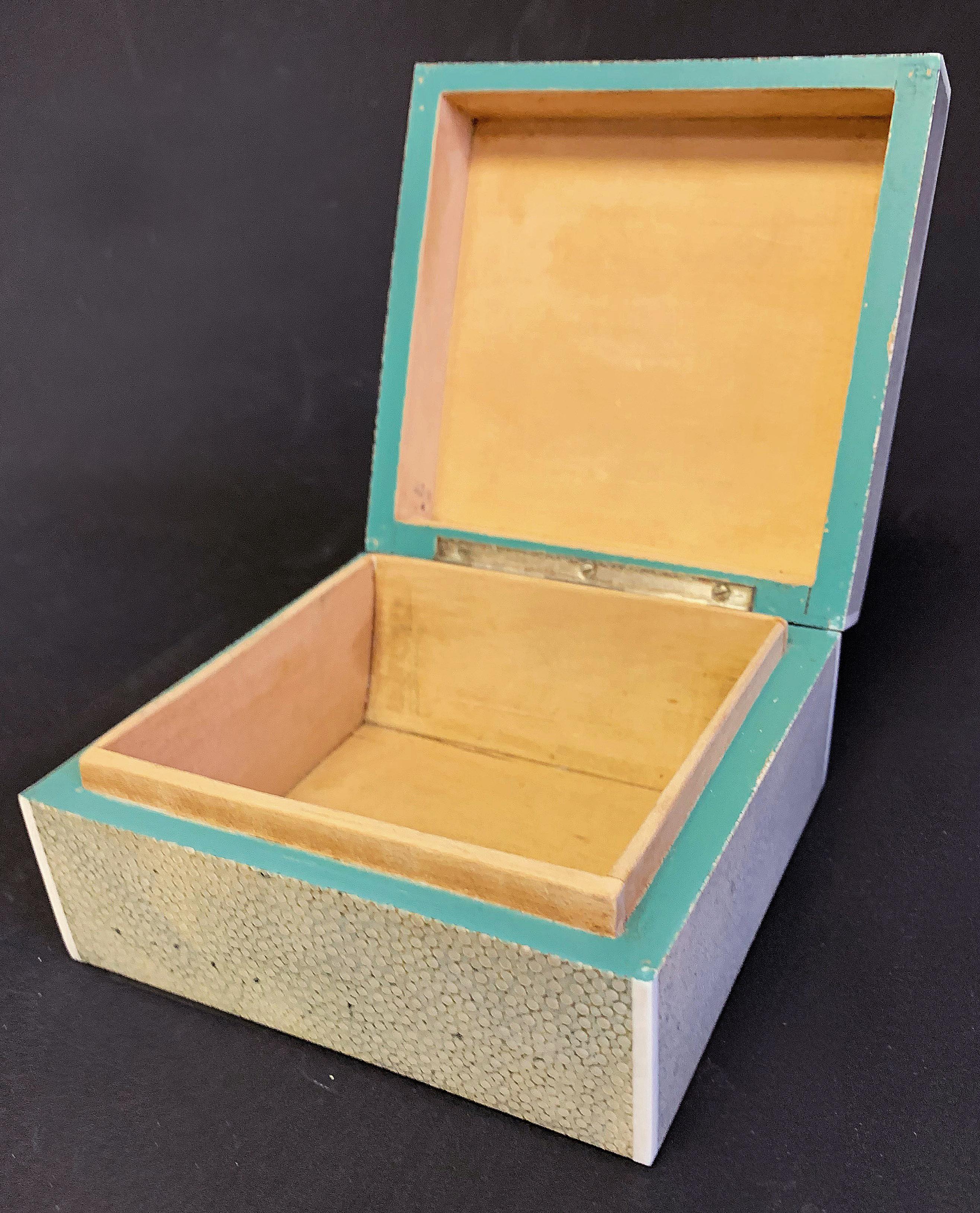 Beautifully finished in panels of ivory-toned shagreen, this hinged box is a superb example of the craftsmanship practiced by the famed Asprey Company in London. Founded in the late 18th century, Asprey hired silversmiths, goldsmiths, jewellers and