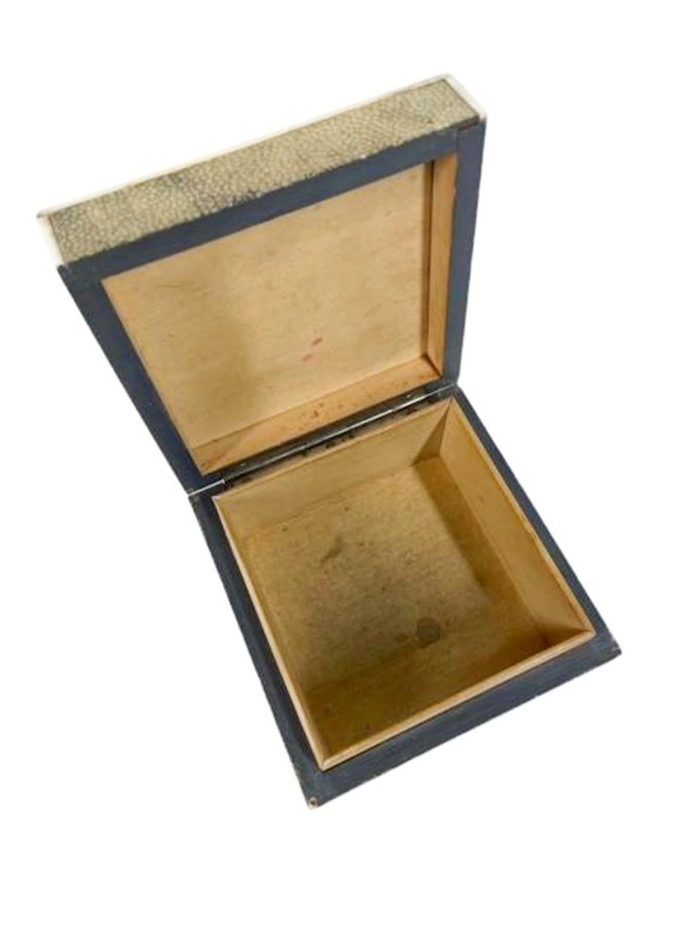 Art Deco shagreen covered cedar box with bone edges, the snug fitting lid attached at the back with a single long stop hinge to prevent the lid falling back when open. The leather covered bottom stamped 