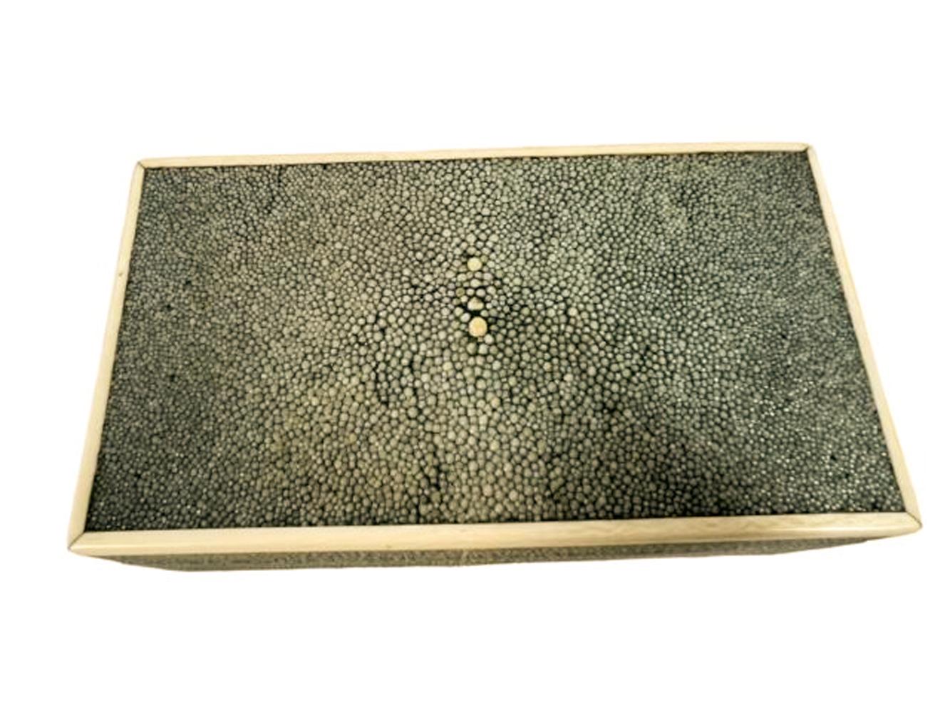 Art Deco shagreen covered box with hinged lid and bone edges. The lid closes snugly, and the interior is clean, the bottom retains its original baize cover.