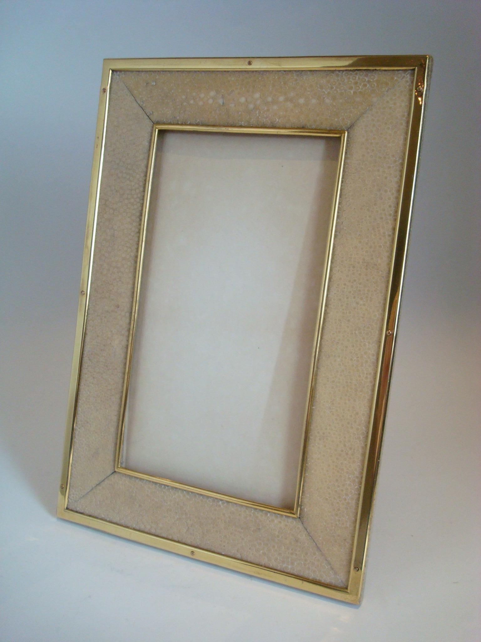 Art Deco Shagreen photograph frame, c. 1925.
20th century vintage Shagreen (Galuchat) leather photo frame.
Very well made rectangular Shagreen frame with gilt bronze borders, as shown on the images the shagreen is a great color. The back is also