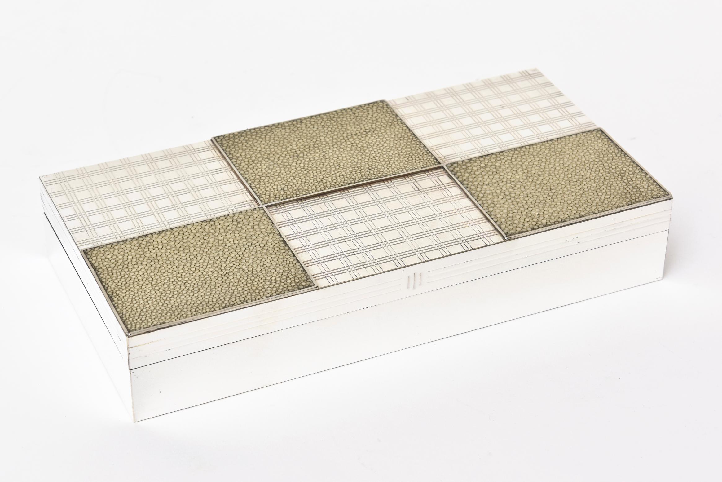 Thus stunning and unusual vintage French long rectangular Art Deco shagreen, silver plate and wood hinged box is so elegant. It has an op art pattern of criss cross and is reminiscent of the work of Christian Dior in his home decor and his later