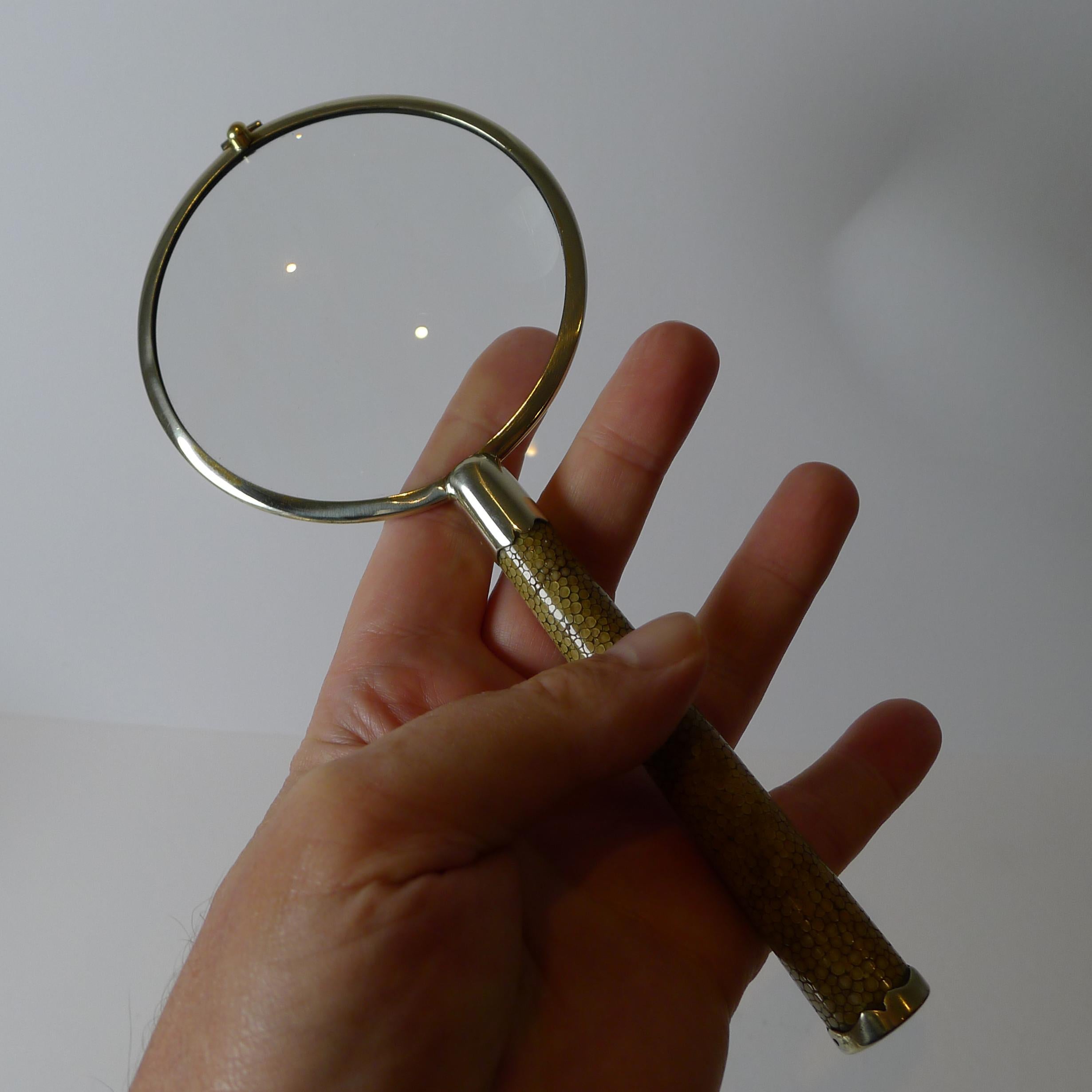 A handsome and most unusual magnifying glass in a winning and highly sought-after combination of English silver plate and Shagreen. 

The ferrule frame and terminal are all silver plated, Art Deco in era c.1930.  The glass lens is the original with