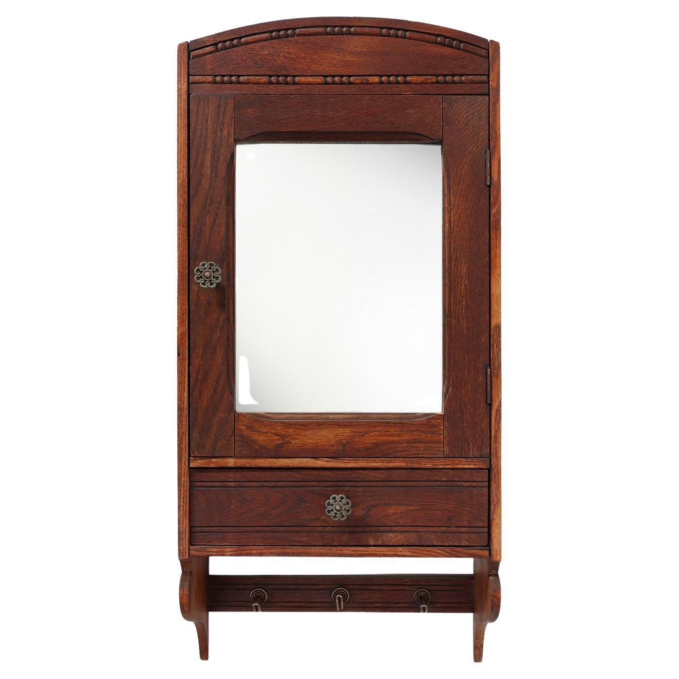 Art Deco shaving cabinet in oak with beveled mirror, France ca. 1900