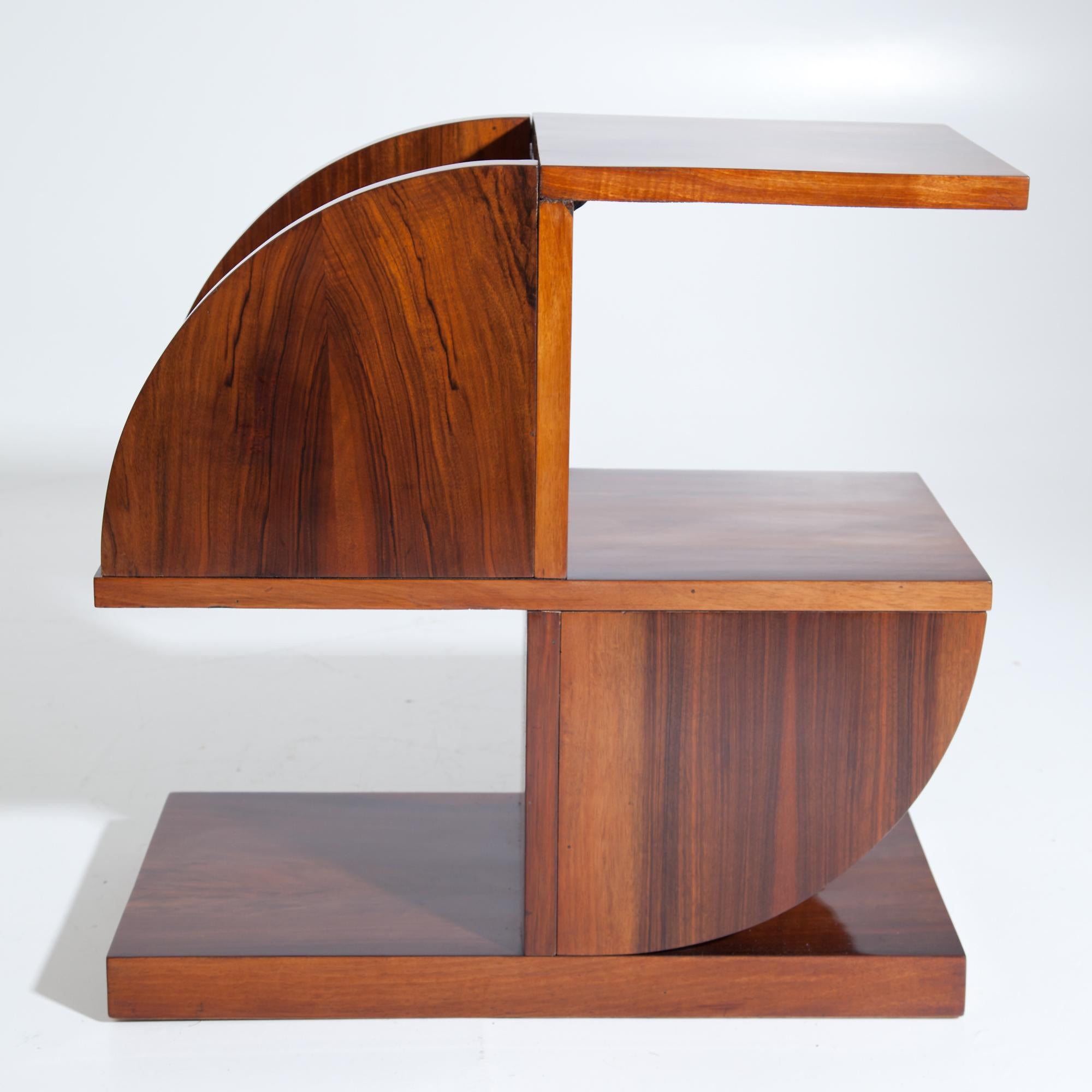 Geometrically designed Art Deco walnut shelf with three shelves and two compartments surrounded by circular segments.