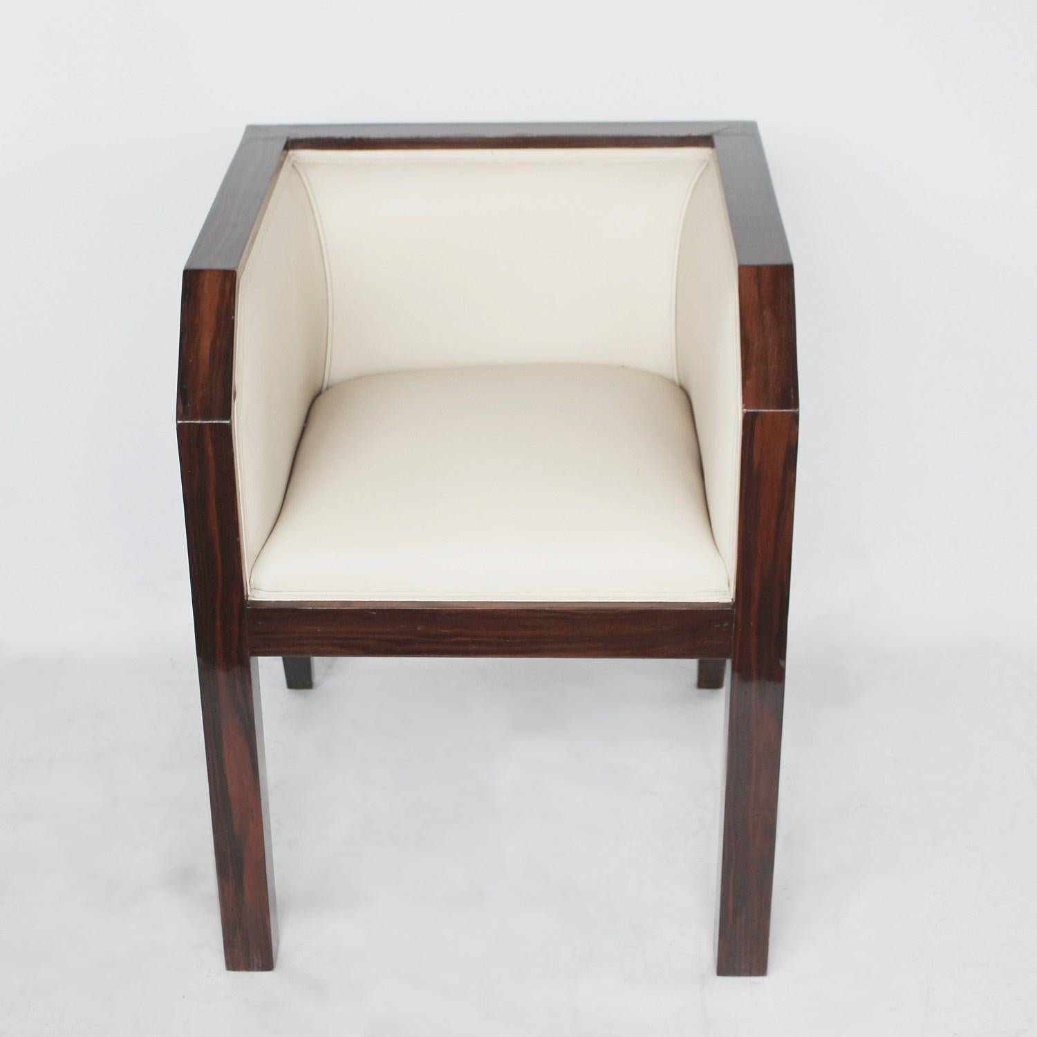 An Art Deco side chair in the modernist style. Figured Macassar ebony surround. Upholstered in cream leather.

Dimensions: H 72cm, W 55cm, D 60cm, seat H 48cm, seat D 50cm.

 