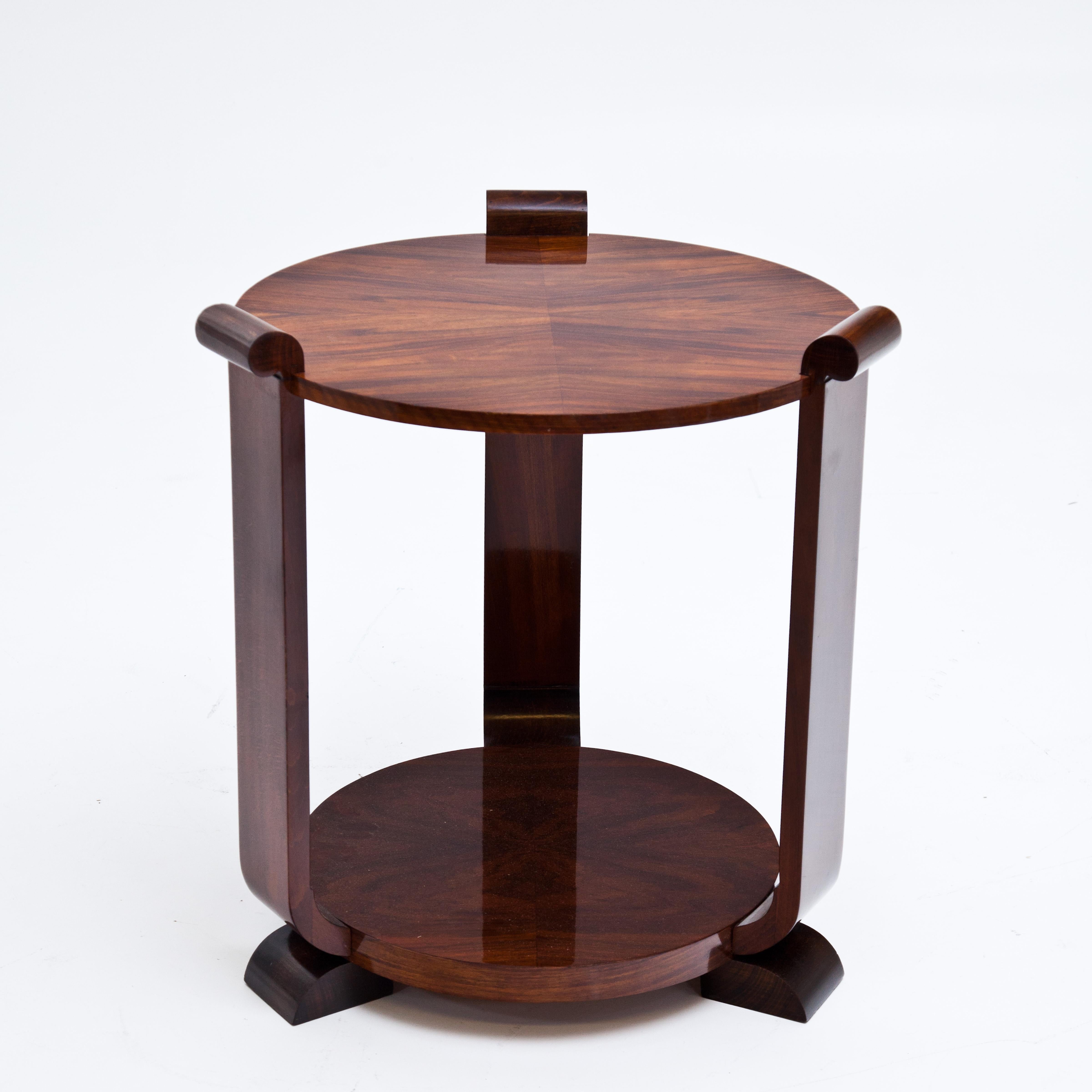 Art Deco side tables with round shelves supported by three legs. Very nice veneer, hand-polished.