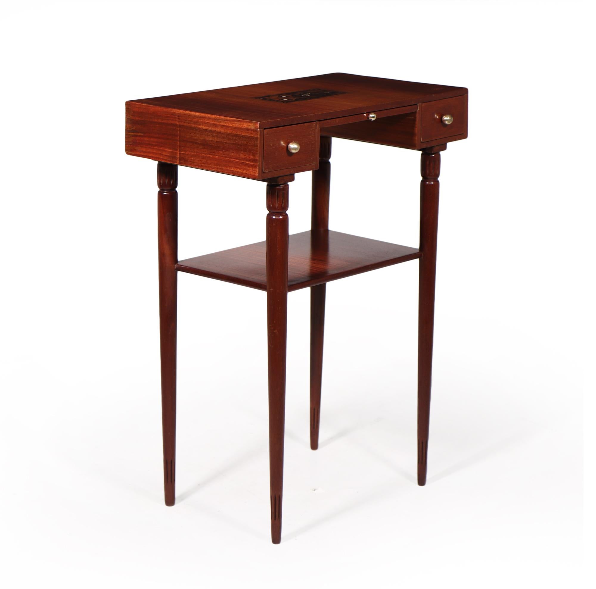 A rare early French art deco side table with two drawers and a center slide, macassar ebony inlaid stingray to the top with the Marjorelle signature to the top also, The table has been restored where necessary and fully polished by hand and in
