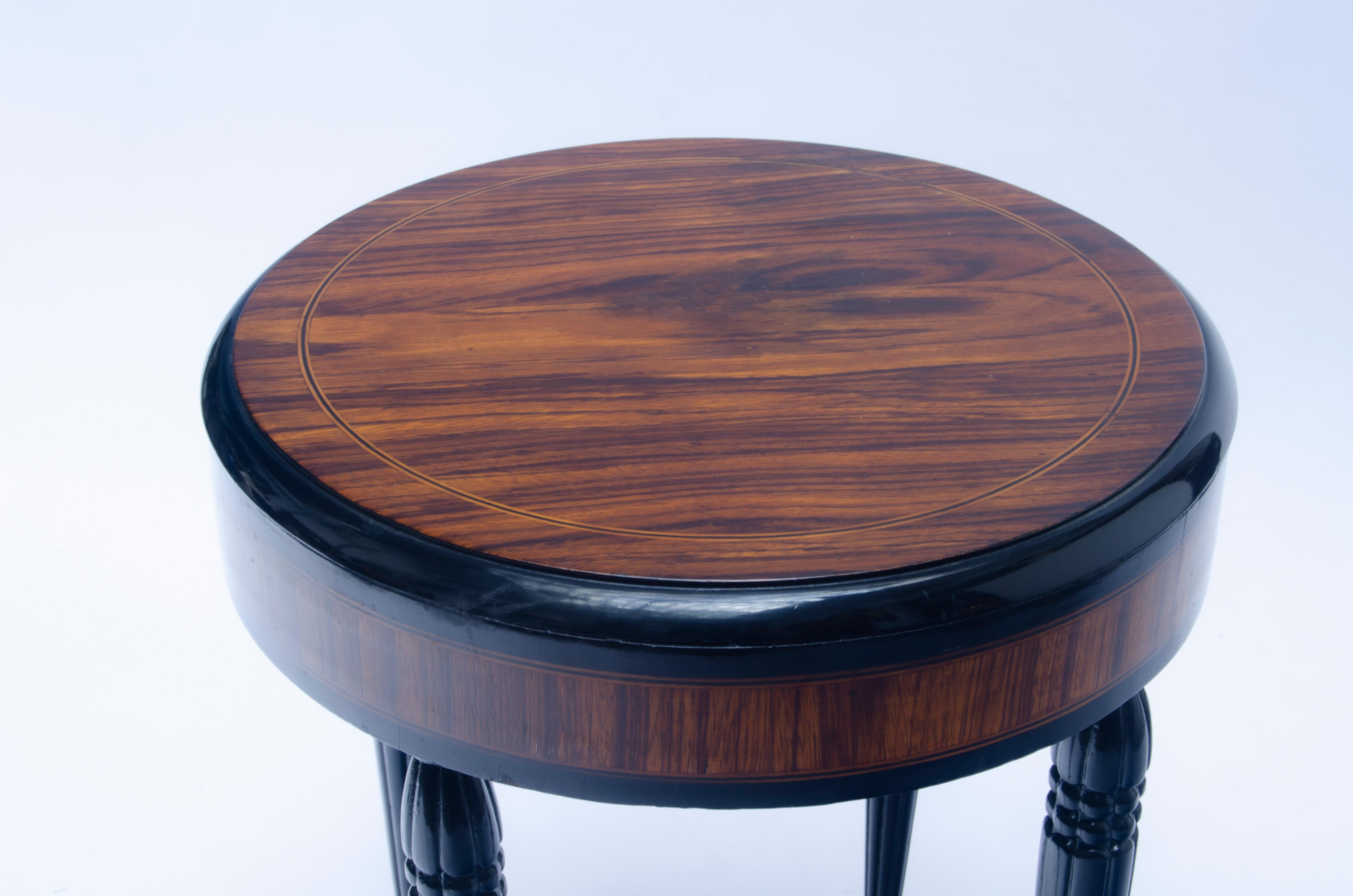 Art Deco table designed by Maurice Dufrene (1879-1955). wood and details in block gloss.

Argus Valentine's (2003) 