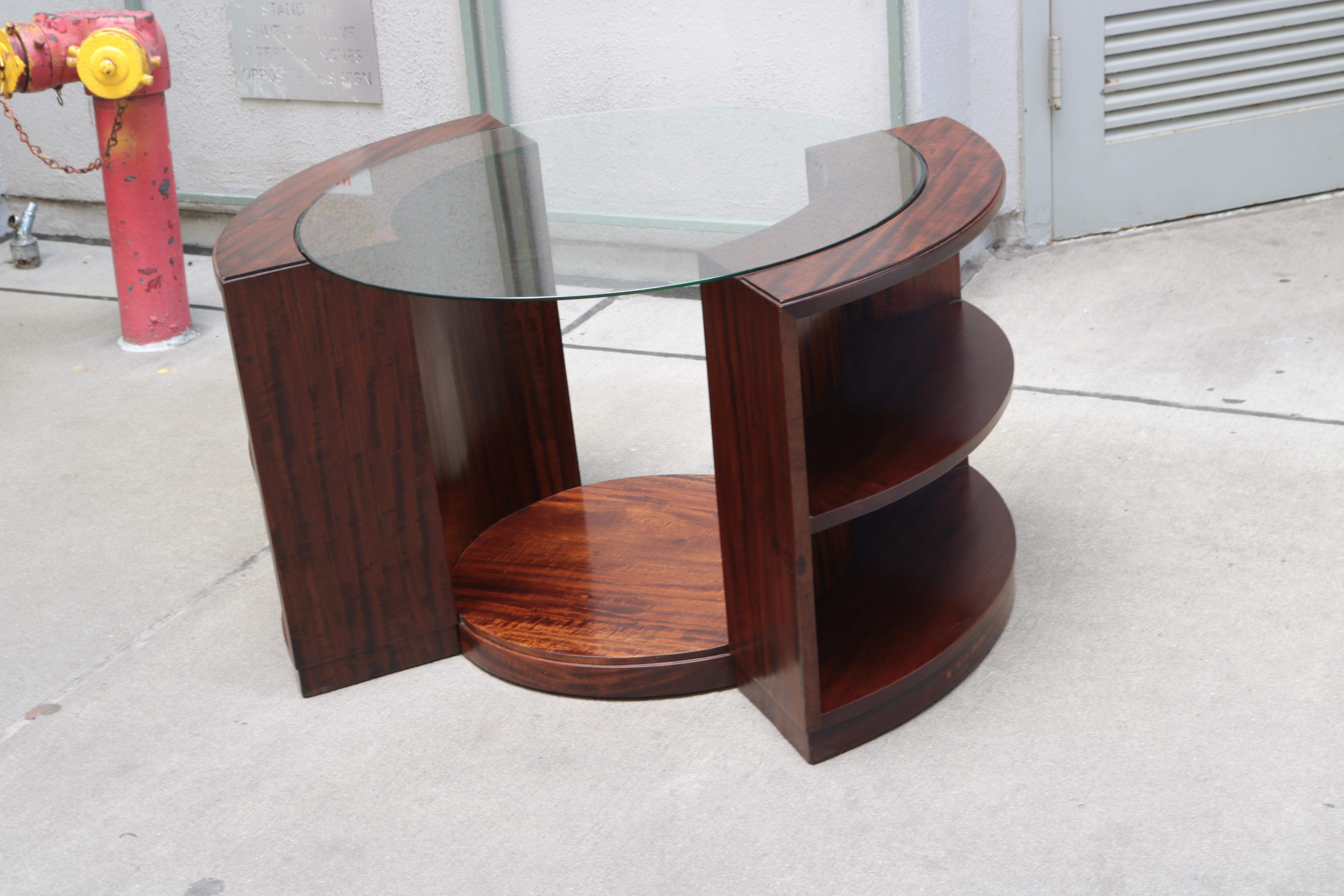 Art Deco side table with glass top by Phillippe Petit. 
Walnut and glass. See detail shots for period image of this table in situ.

 