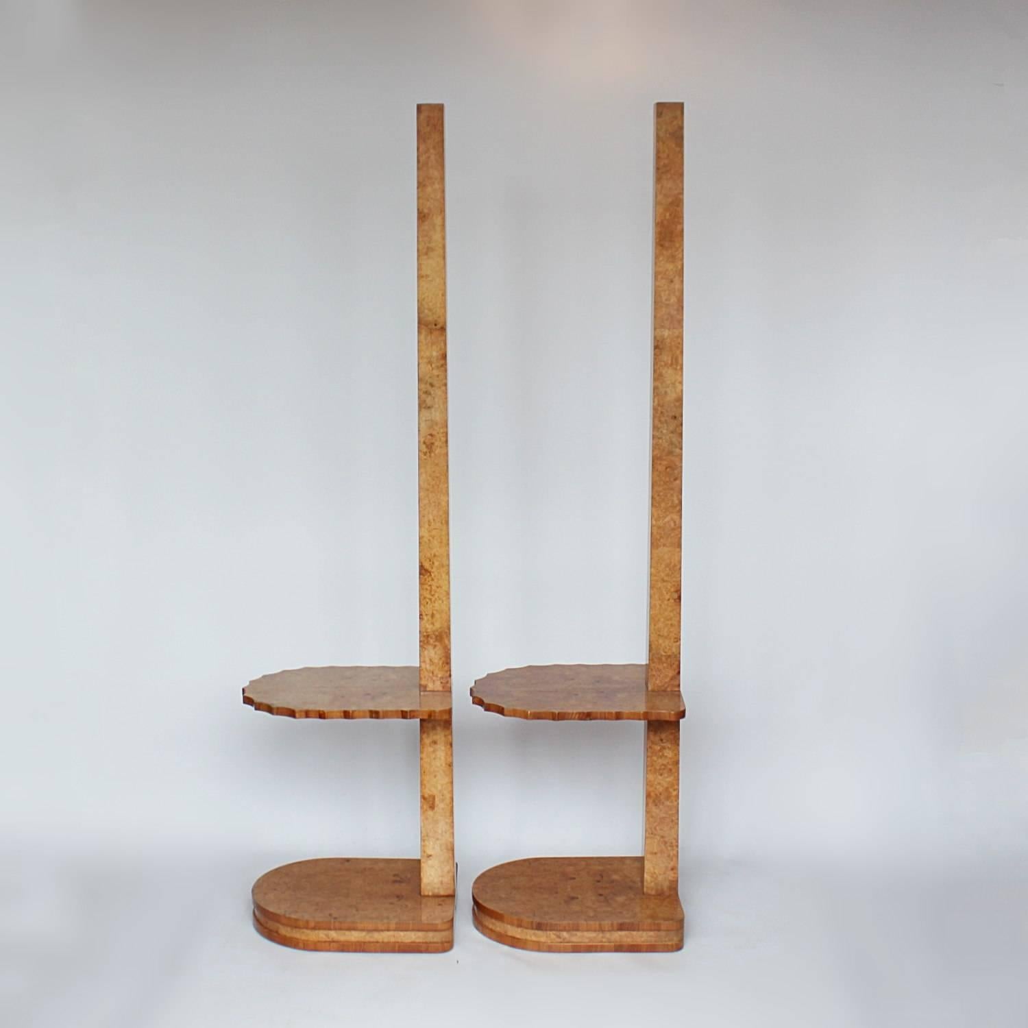 A pair of Art Deco side table floor lamps by Harry & Lou Epstein. Fluted edge floating side tables set to a burr walnut floor lamp.
 