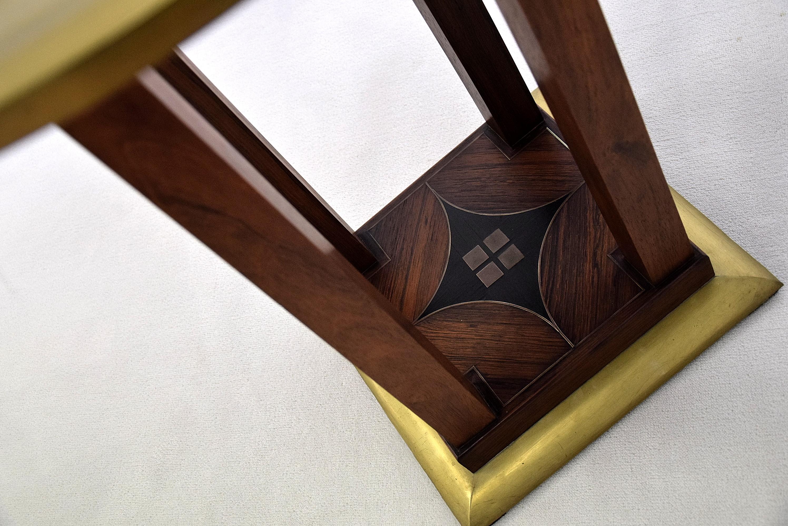 Rosewood, ebony and brass Art Deco side table with beautiful details in the base as can be seen in the images.

This stunning piece of Dutch Art Deco was made in the early 1930s.

Measurements: D.60 x H.67.5 cm.

The table will be shipped