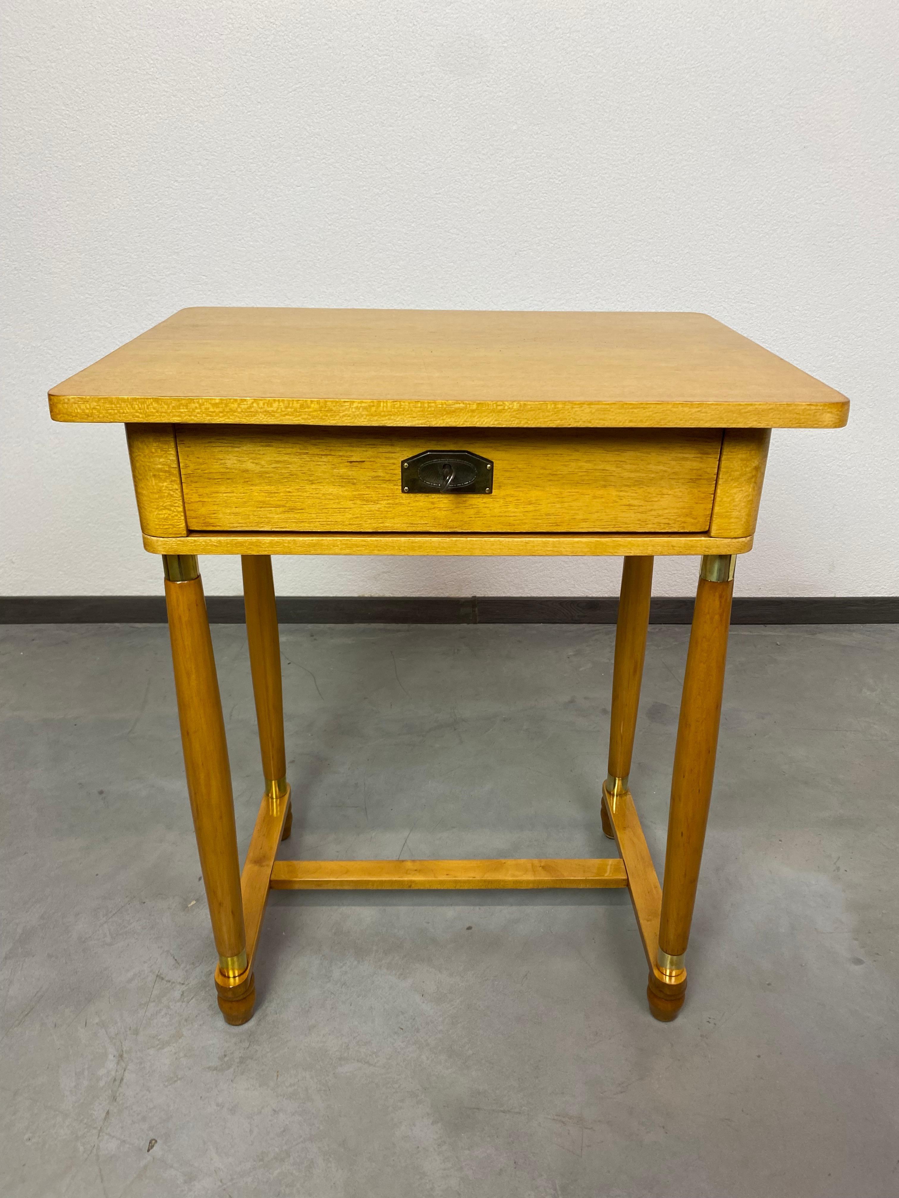 Yellow art deco side table, professionally stained and repolished.
