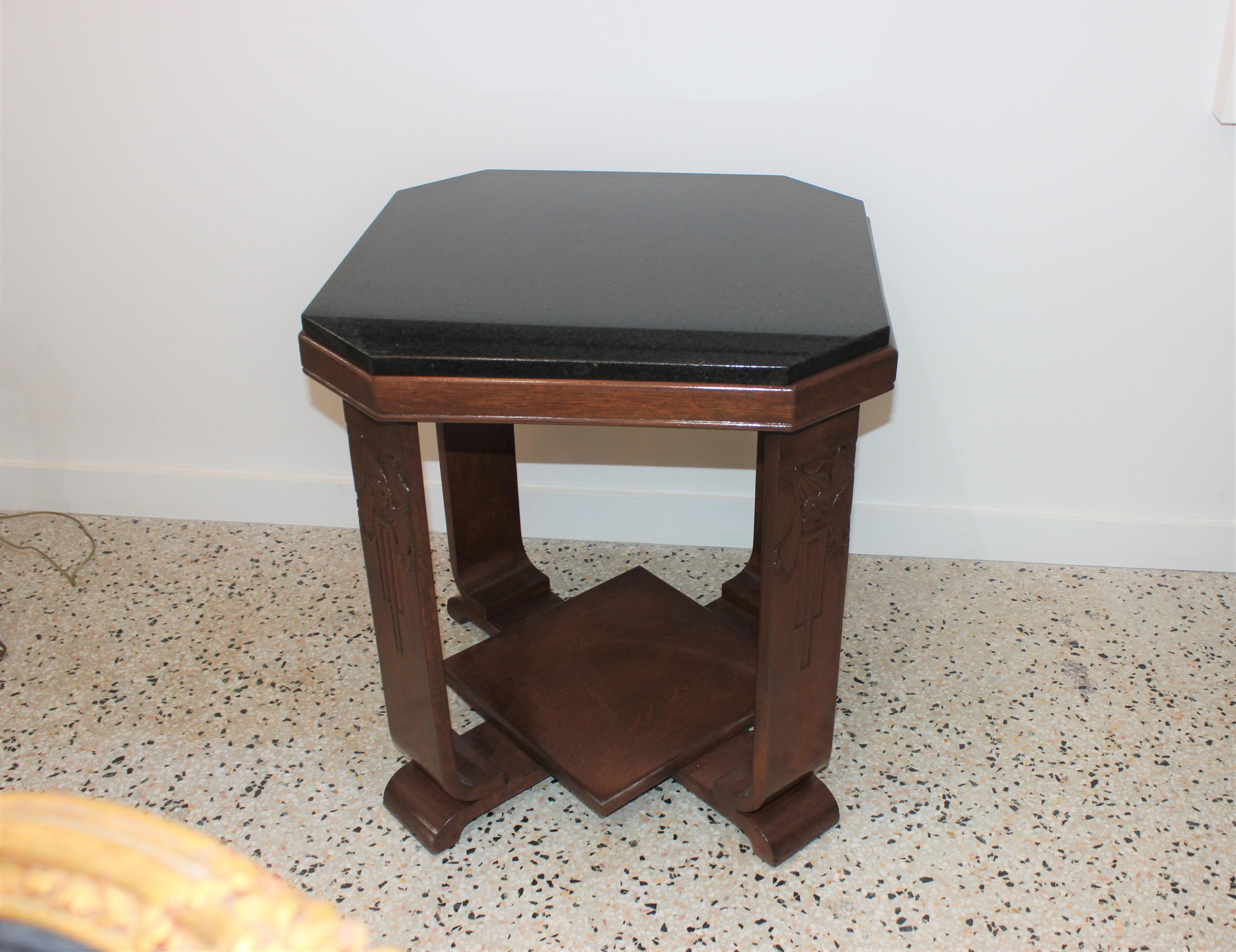 This stylish American Art Deco table is detailed with hand carved stylized flowers and leaves and it was acquired from a Miami Beach estate. The piece dates to the 1920s-1930s. 

Note: The piece has been professionally refinished and a has new