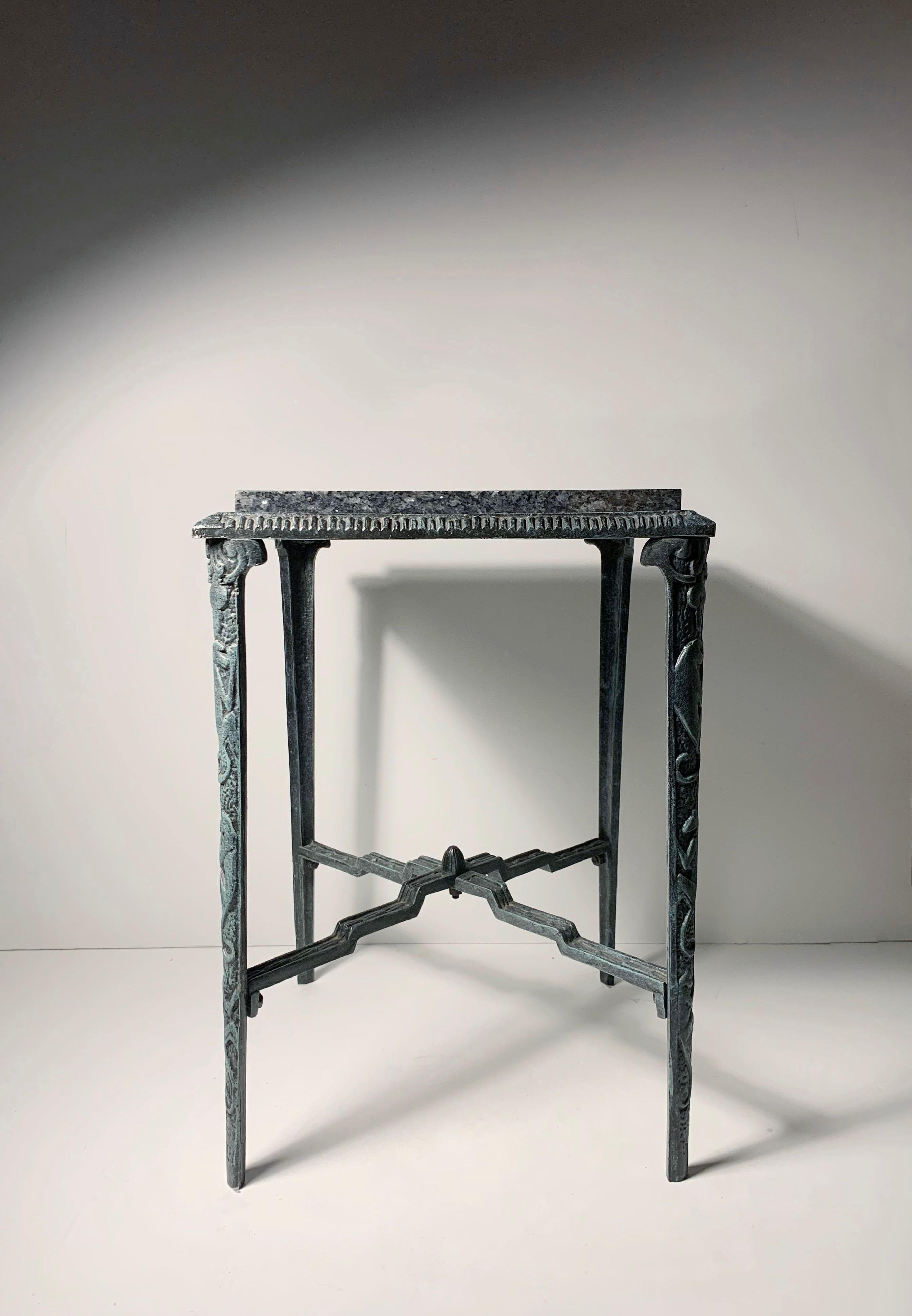 Originally made by Howell Furniture Company in the 1920's in cast iron. This example appears to be a later edition probably from the 1950s/60s in a cast Aluminum with a patina finish. The frame is lightweight and includes the marble that still