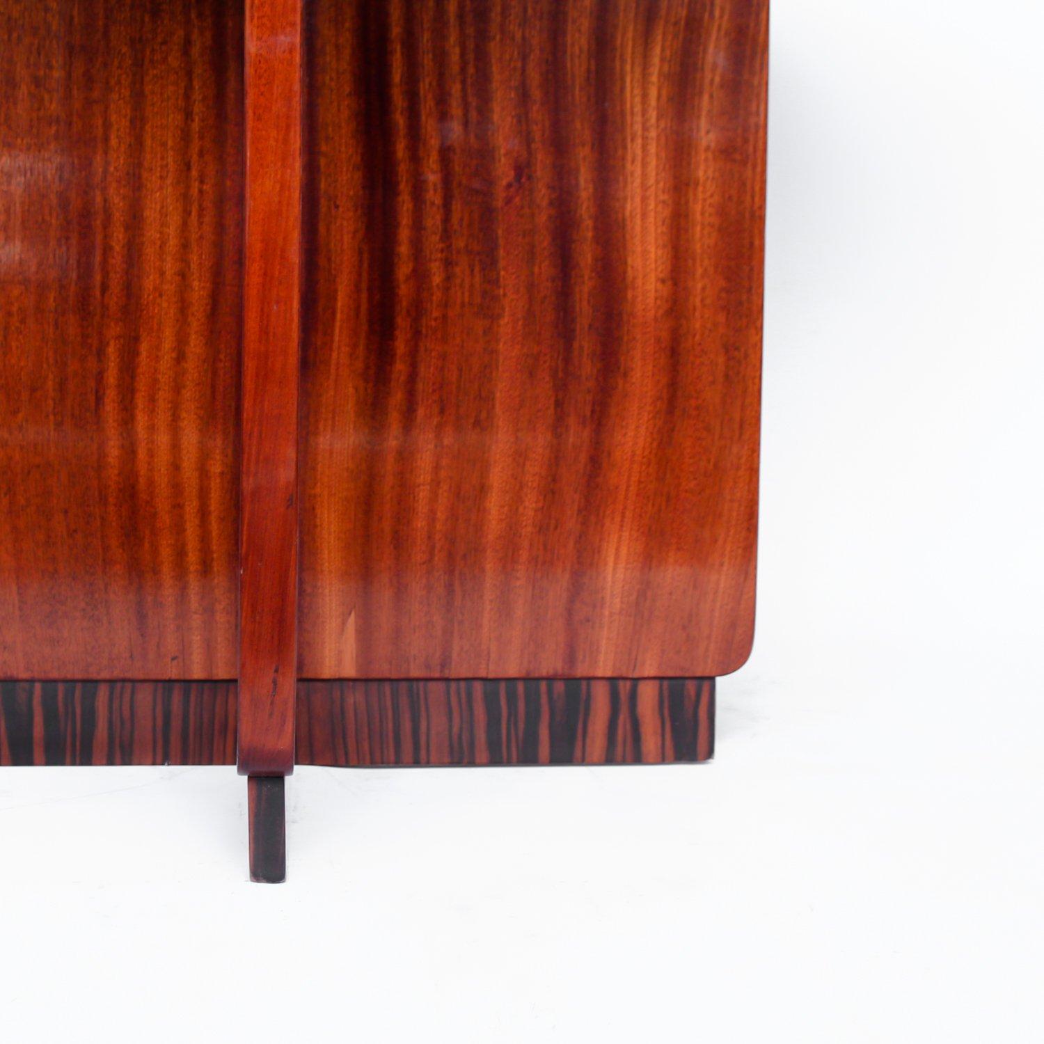 Art Deco, straight grain walnut side table with X-frame Macassar plinth base.

Origin: French,

circa 1925.

 