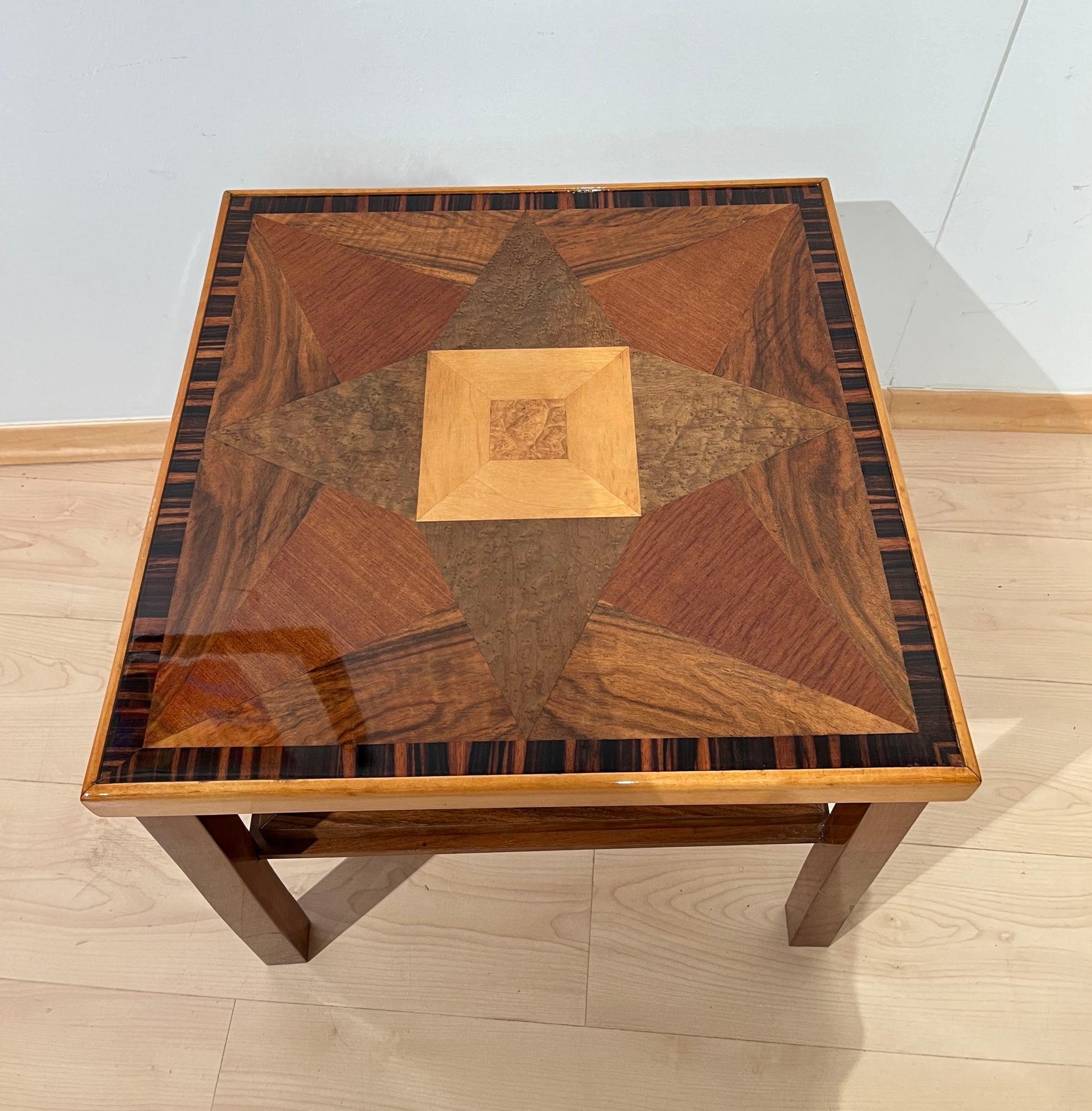 Square modernist Art Deco side, sofa or end table from France, circa 1940.
Various precious wood veneers, including macassar on the edge, walnut, mahogany, stained elm, maple.
Lacquered and high-gloss polished on the top.
Frame made of solid walnut,