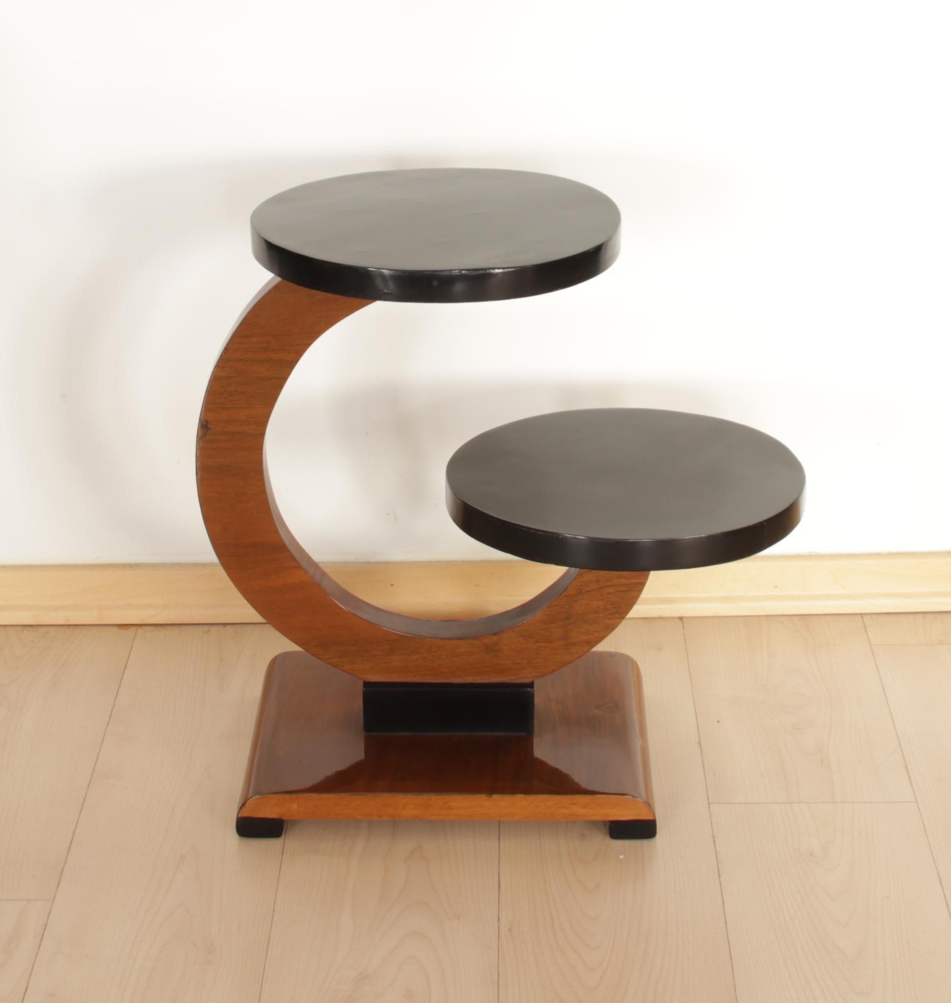 Gorgeous, very elegant, rare original Art Deco side table or plant or flower stand from France, circa 1930.

Walnut veneered on softwood at the round body. Ebonized (black polished) plates, legs and middle bar. All wood has been refinished and